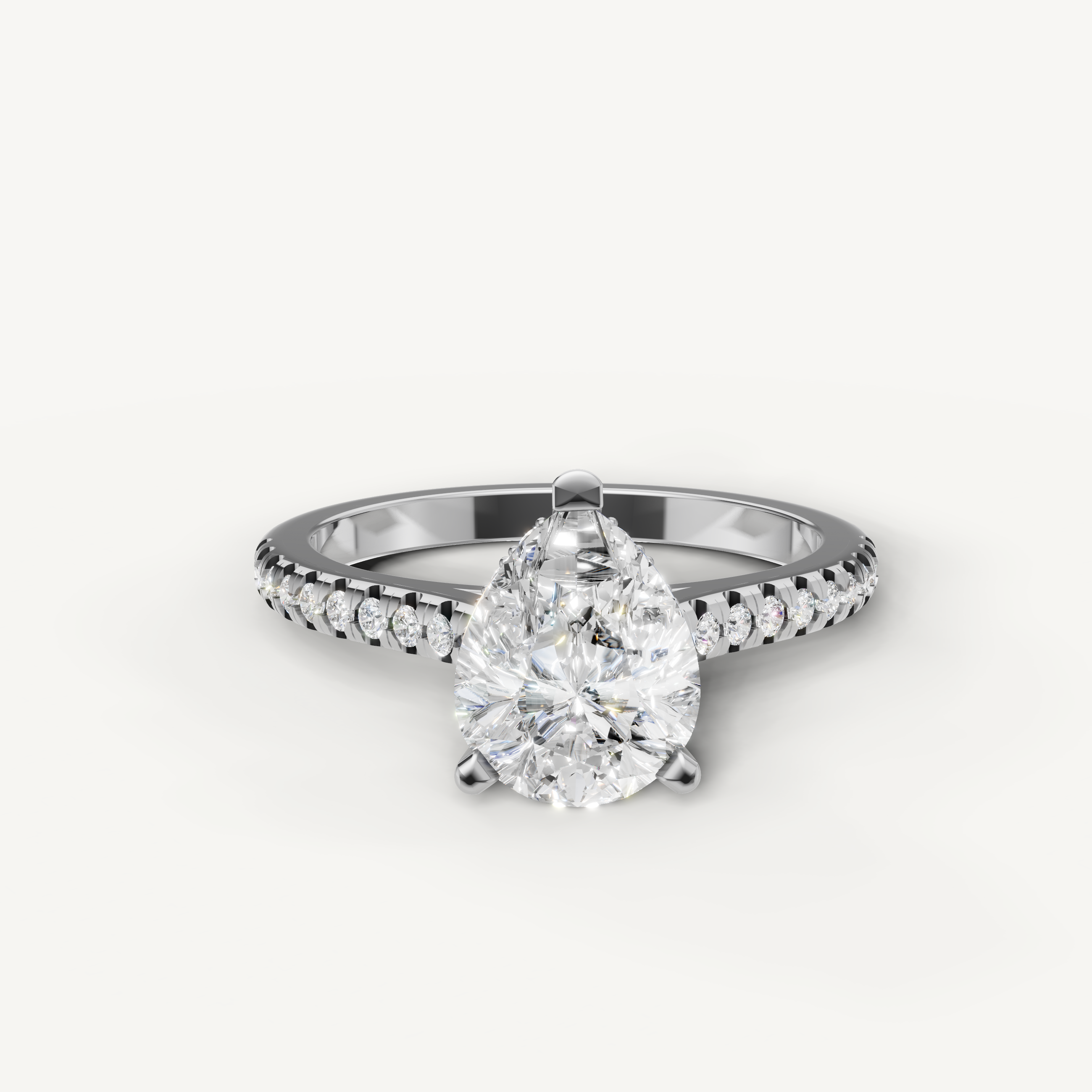 Pear cut lab grown diamond engagement ring with pavé band in 14K white gold by Raul Diamonds