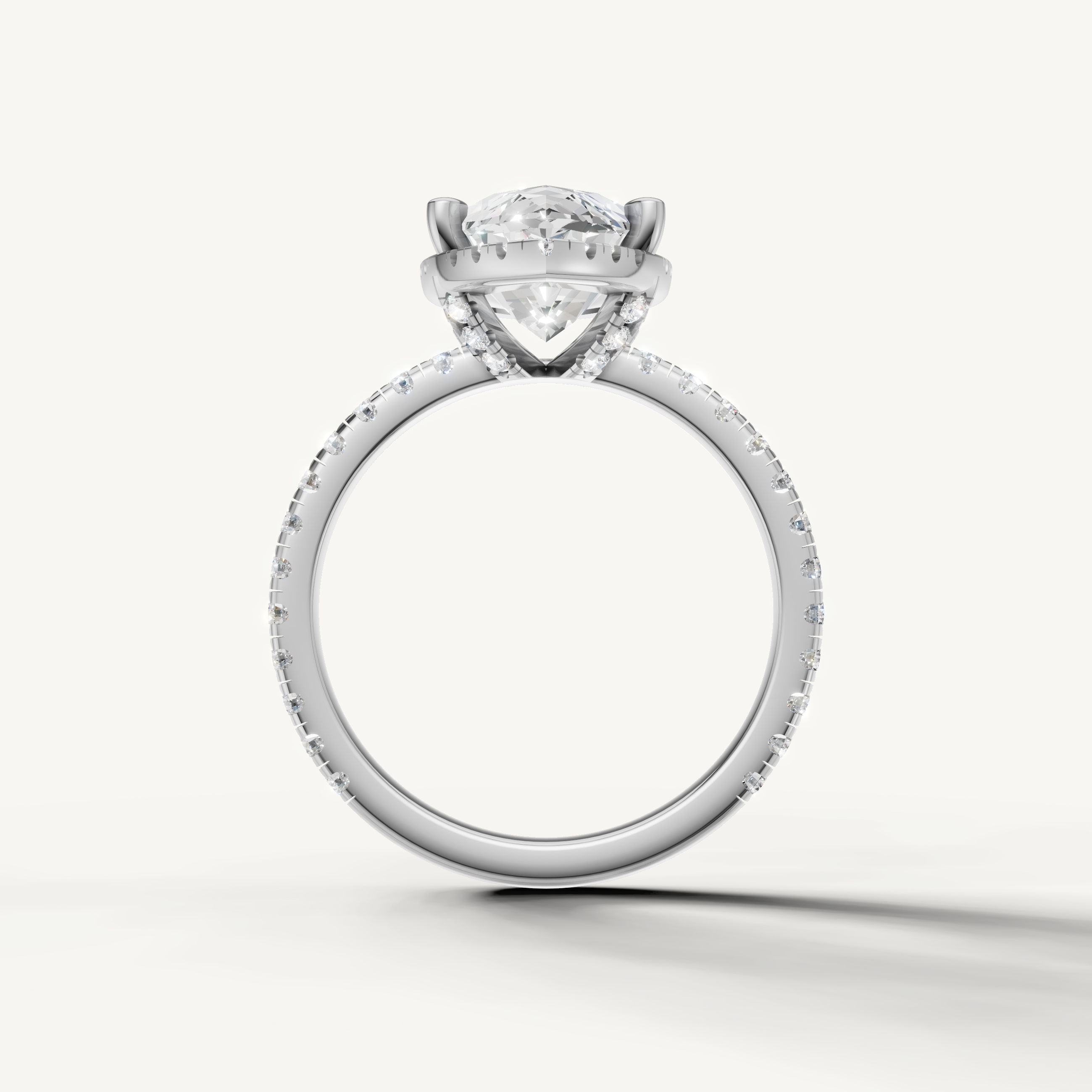 Marquise shape engagement ring with pavé band and hidden halo white gold elegant style