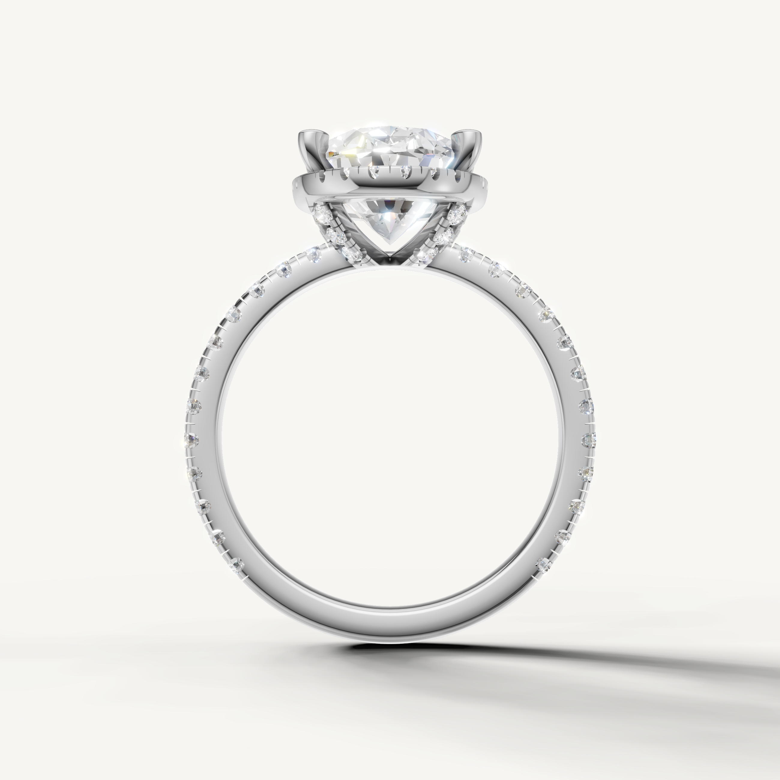 Oval shape engagement ring with pavé band and hidden halo white gold classic style