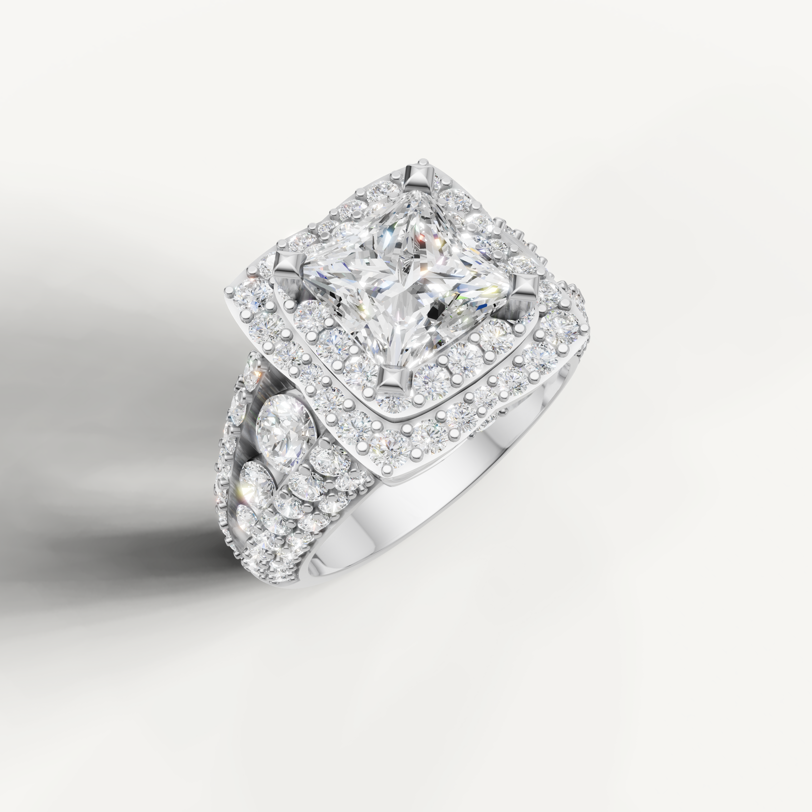 Classic princess diamond ring with double halo and pavé diamonds in white gold.