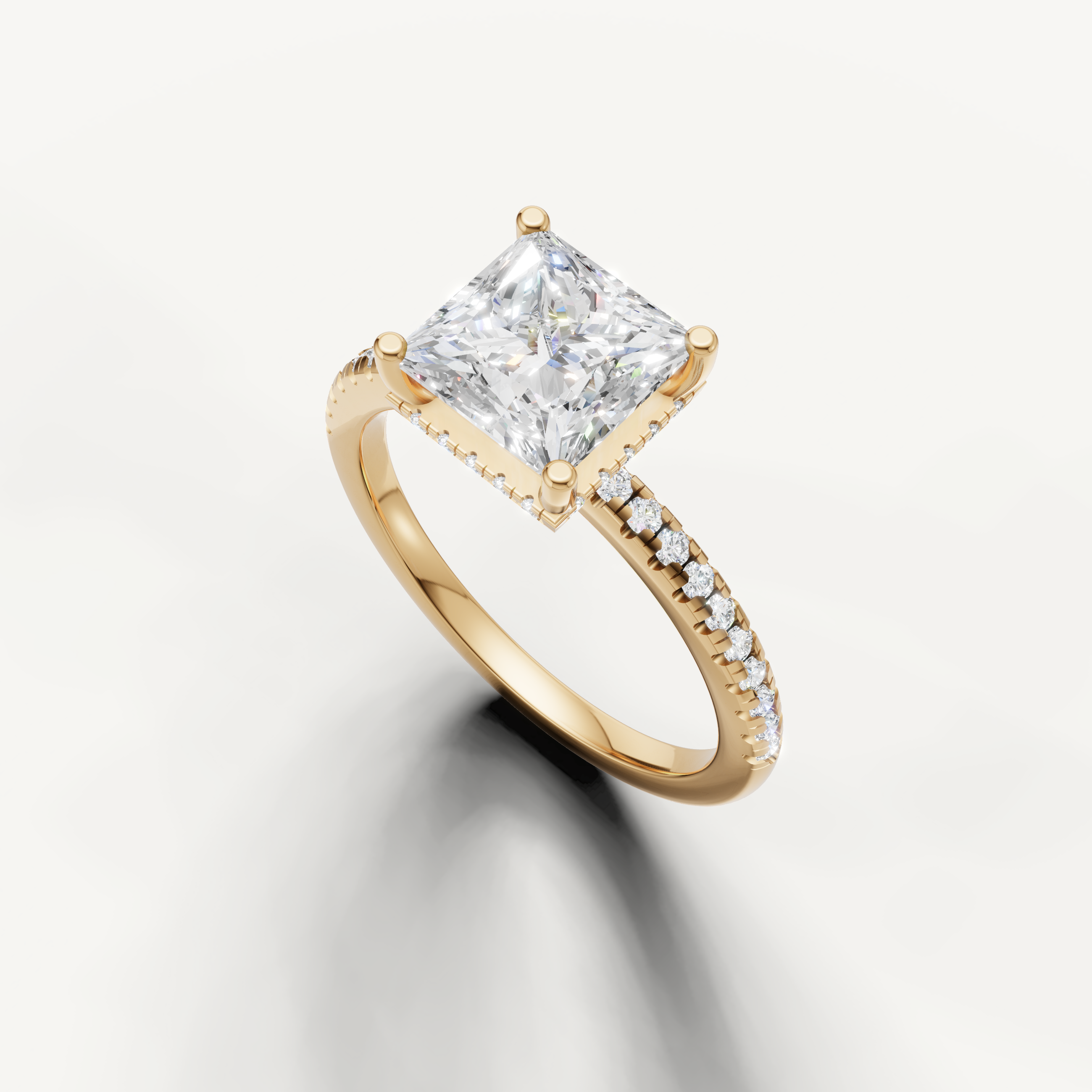 square princess cut engagement ring with sparkling pavé diamonds and slim yellow gold band