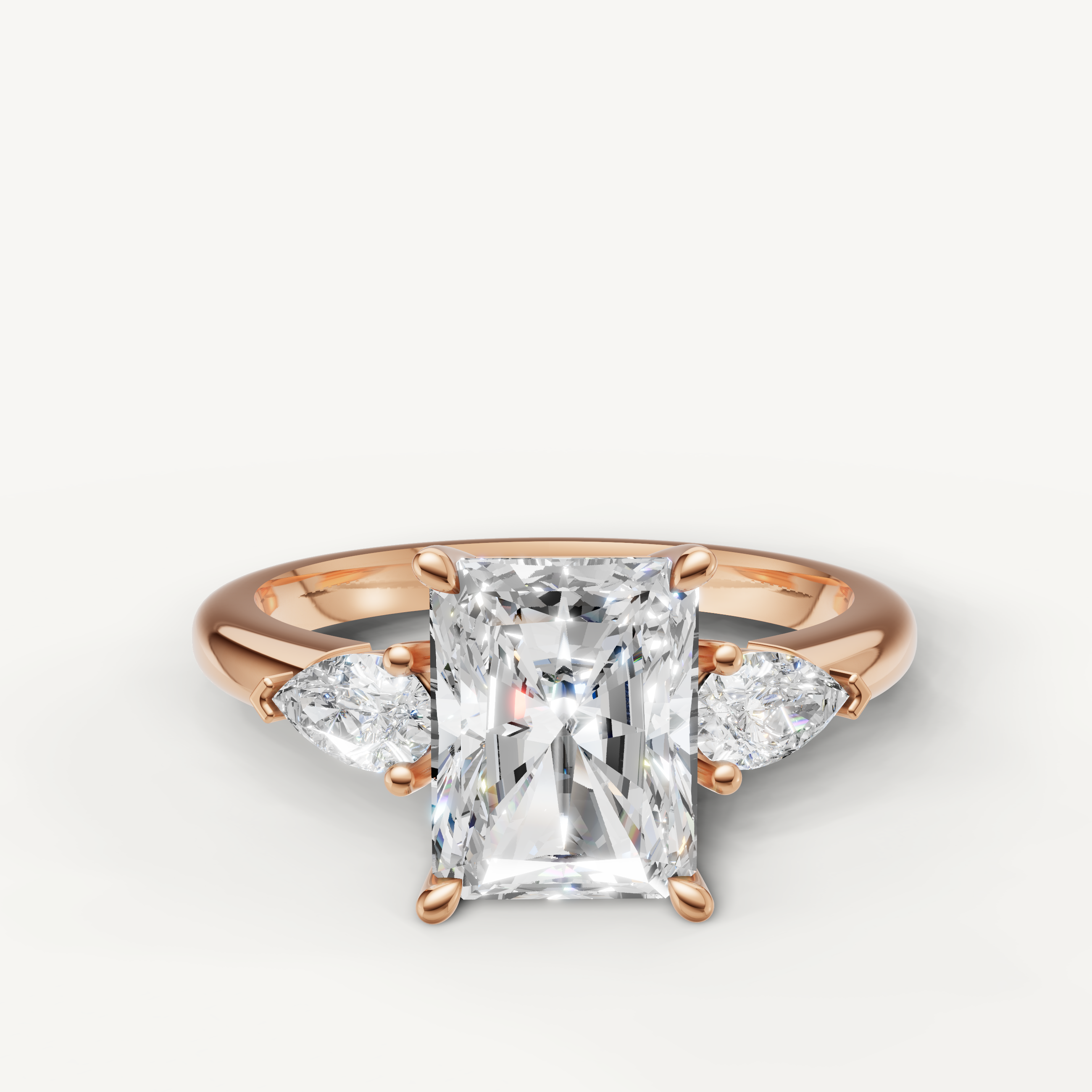 radiant cut lab grown diamond engagement ring with pear side stones in 14k rose gold