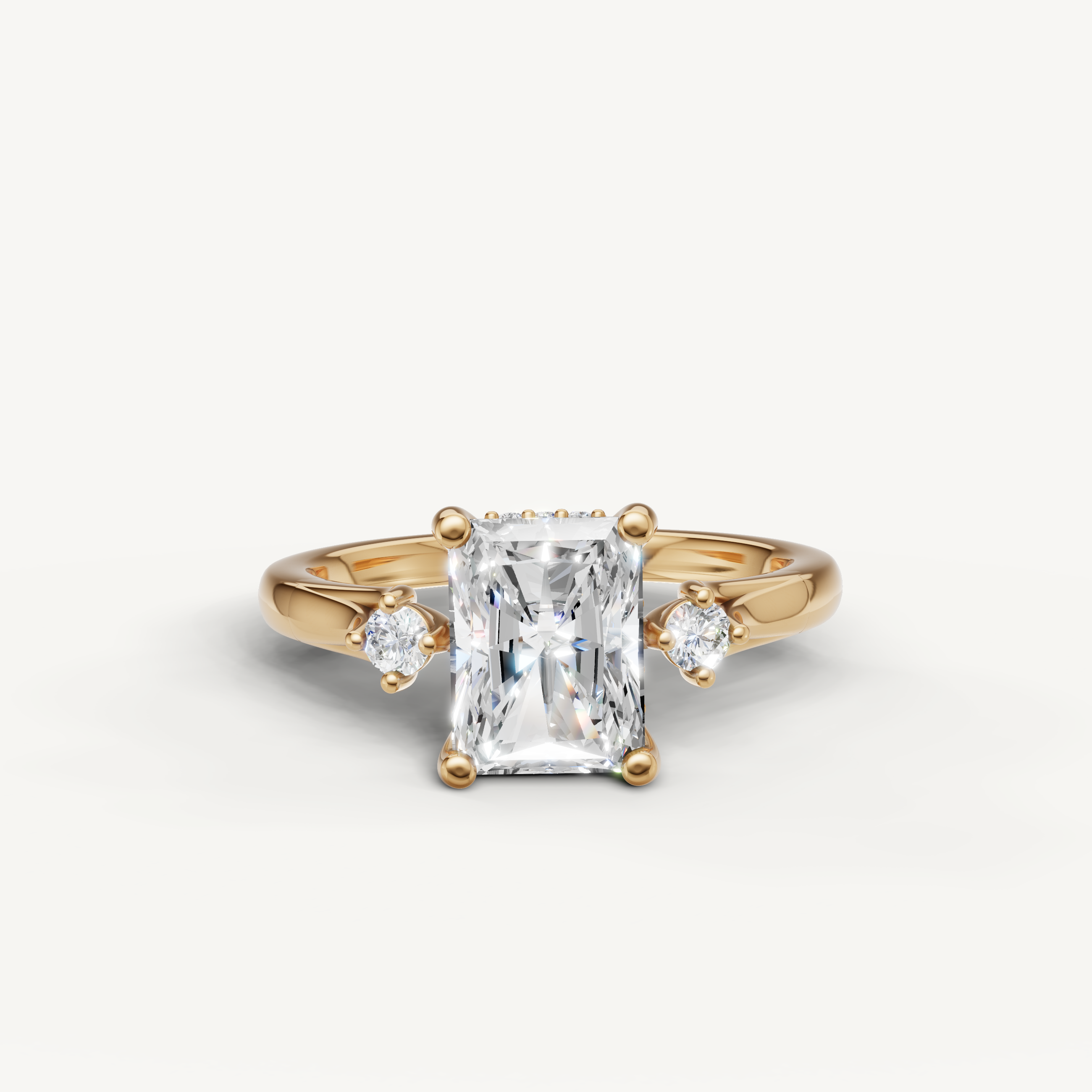 Radiant cut lab grown diamond engagement ring in 14K yellow gold with round side stones by Raul Diamonds