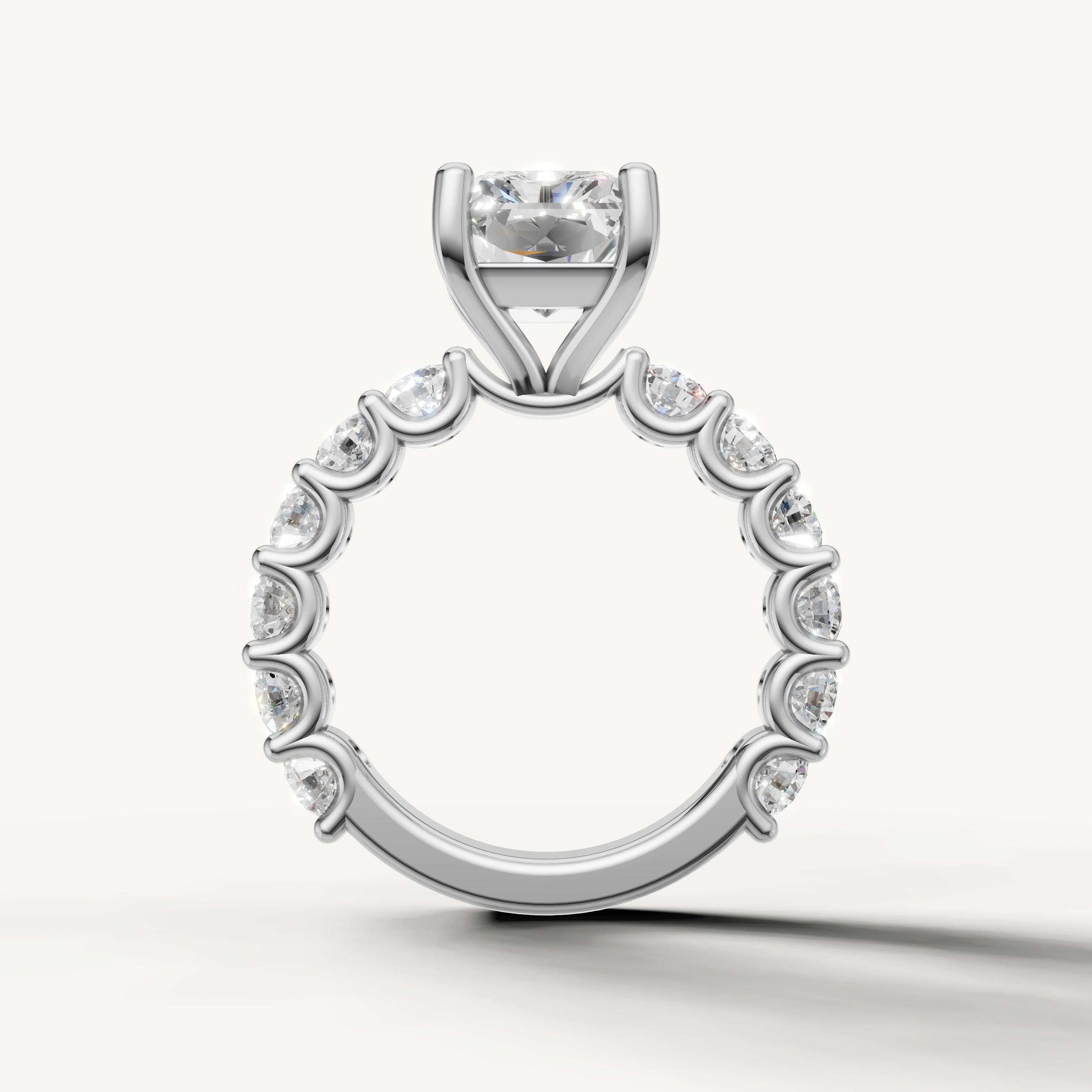 Modern radiant cut ring side profile with full eternity shared prong diamonds white gold