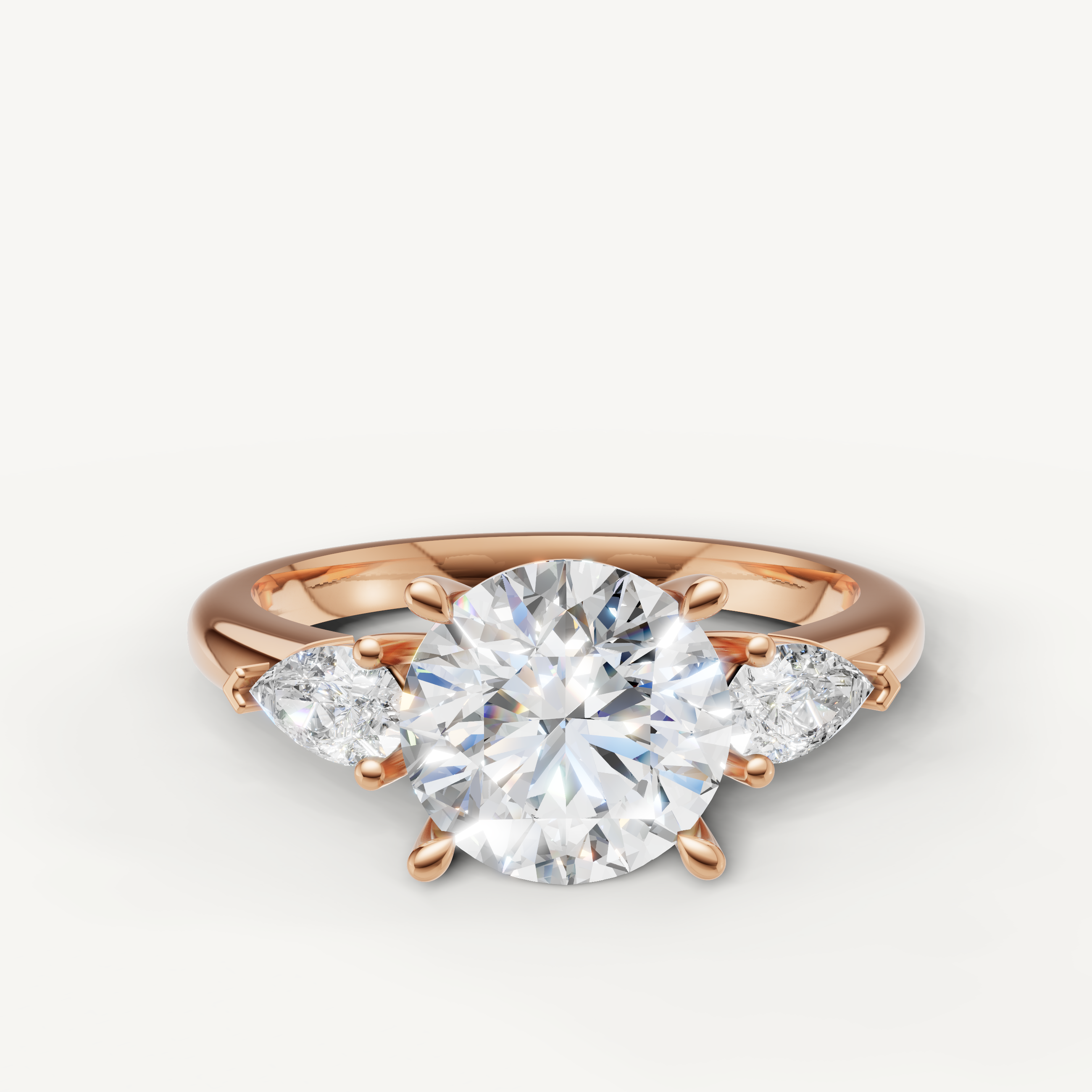round cut lab grown diamond engagement ring with marquise side stones in 14k rose gold