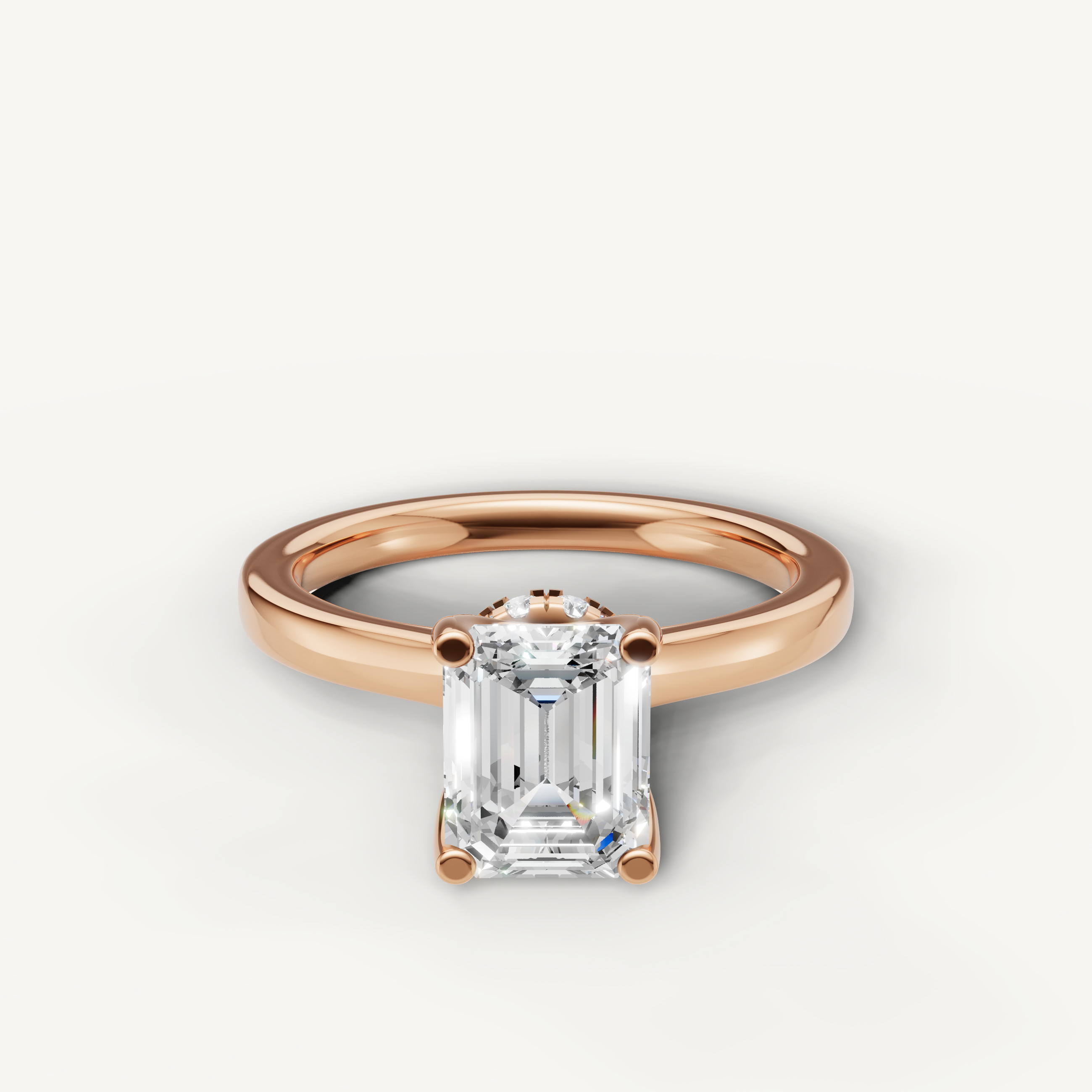 emerald cut lab grown diamond solitaire engagement ring in 14k rose gold with hidden halo