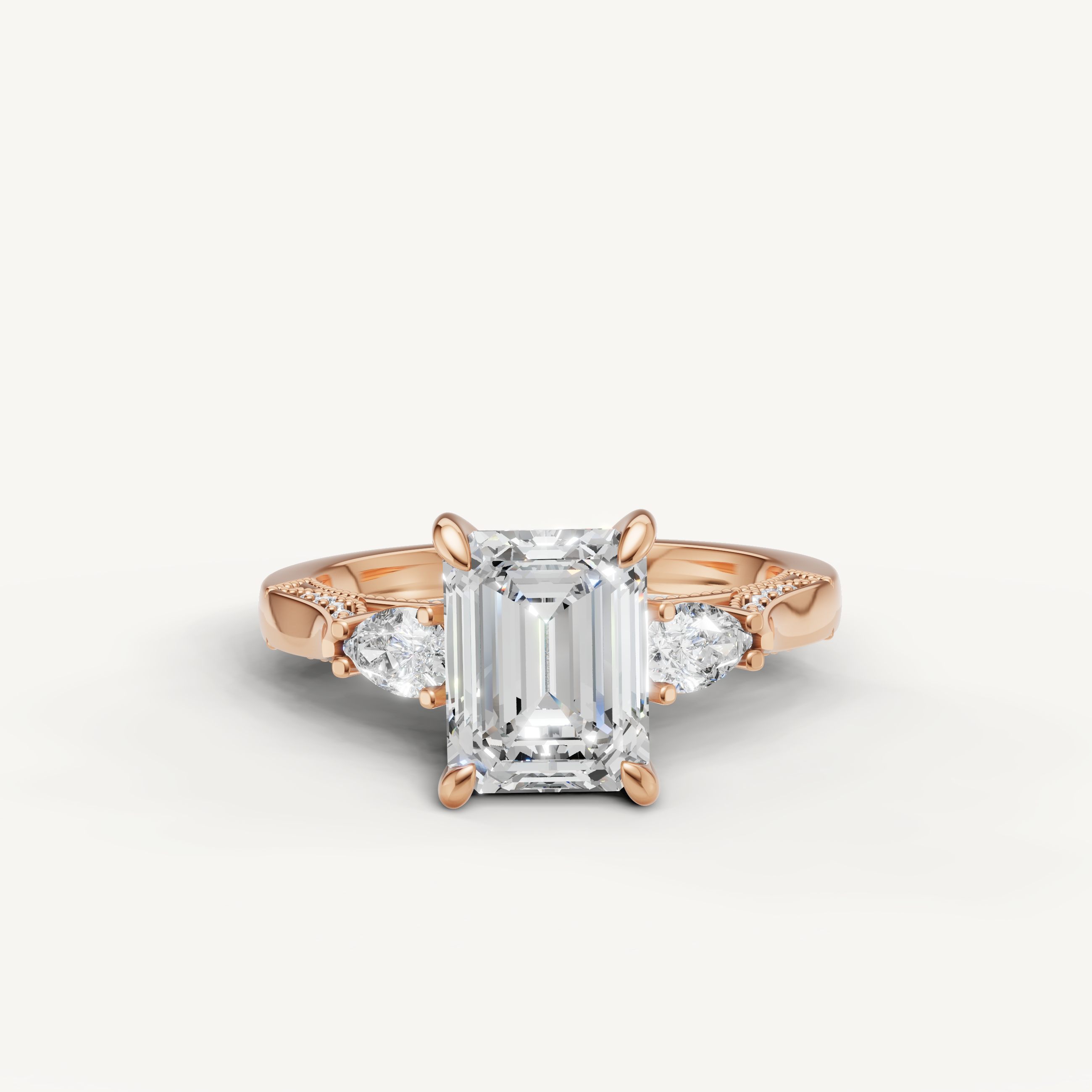 Emerald cut lab grown diamond three stone ring with pear side stones rose gold engagement ring