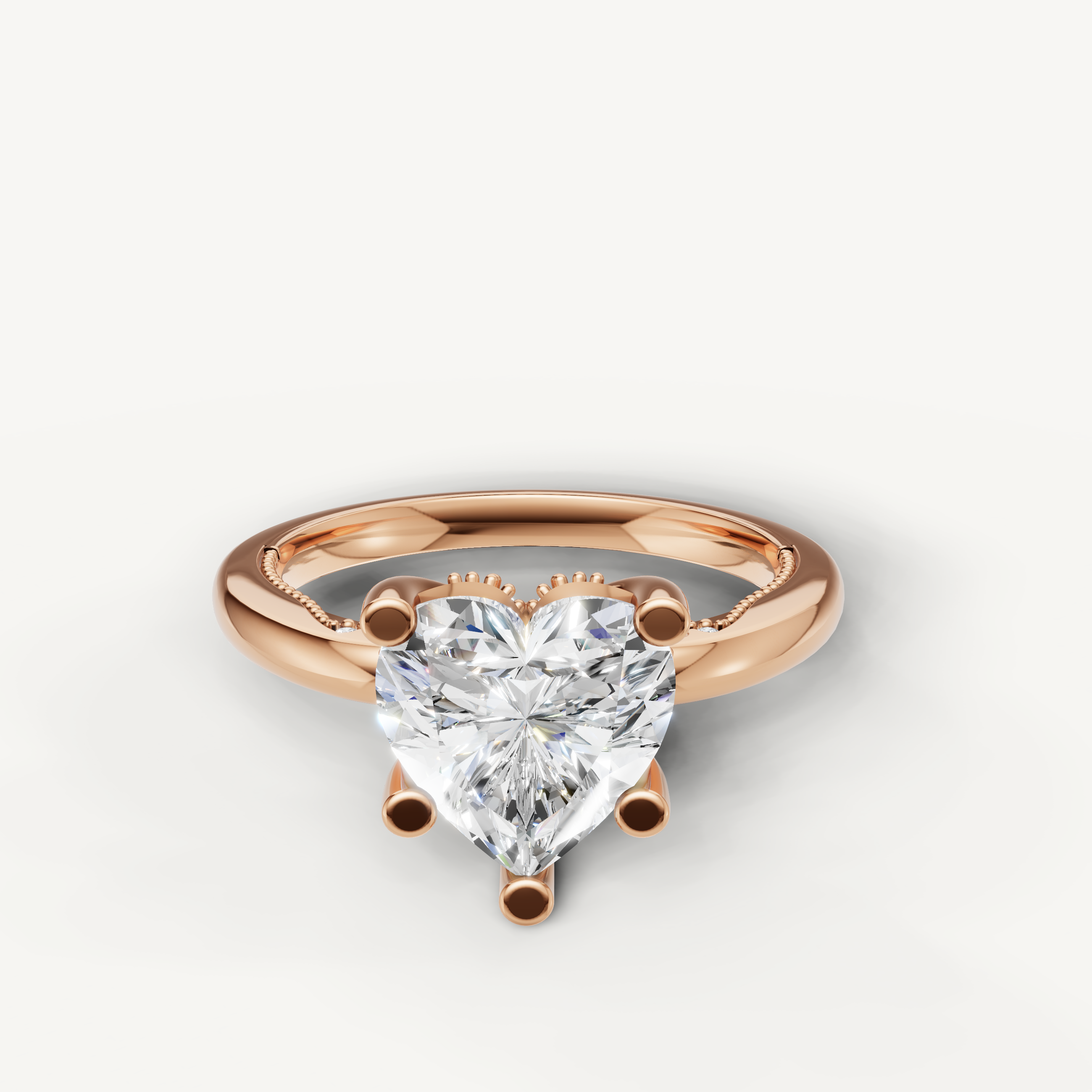 A dreamy and modern engagement ring crafted in blushing 14k rose gold, featuring a stunning heart-cut diamond in a delicate prong mount.
