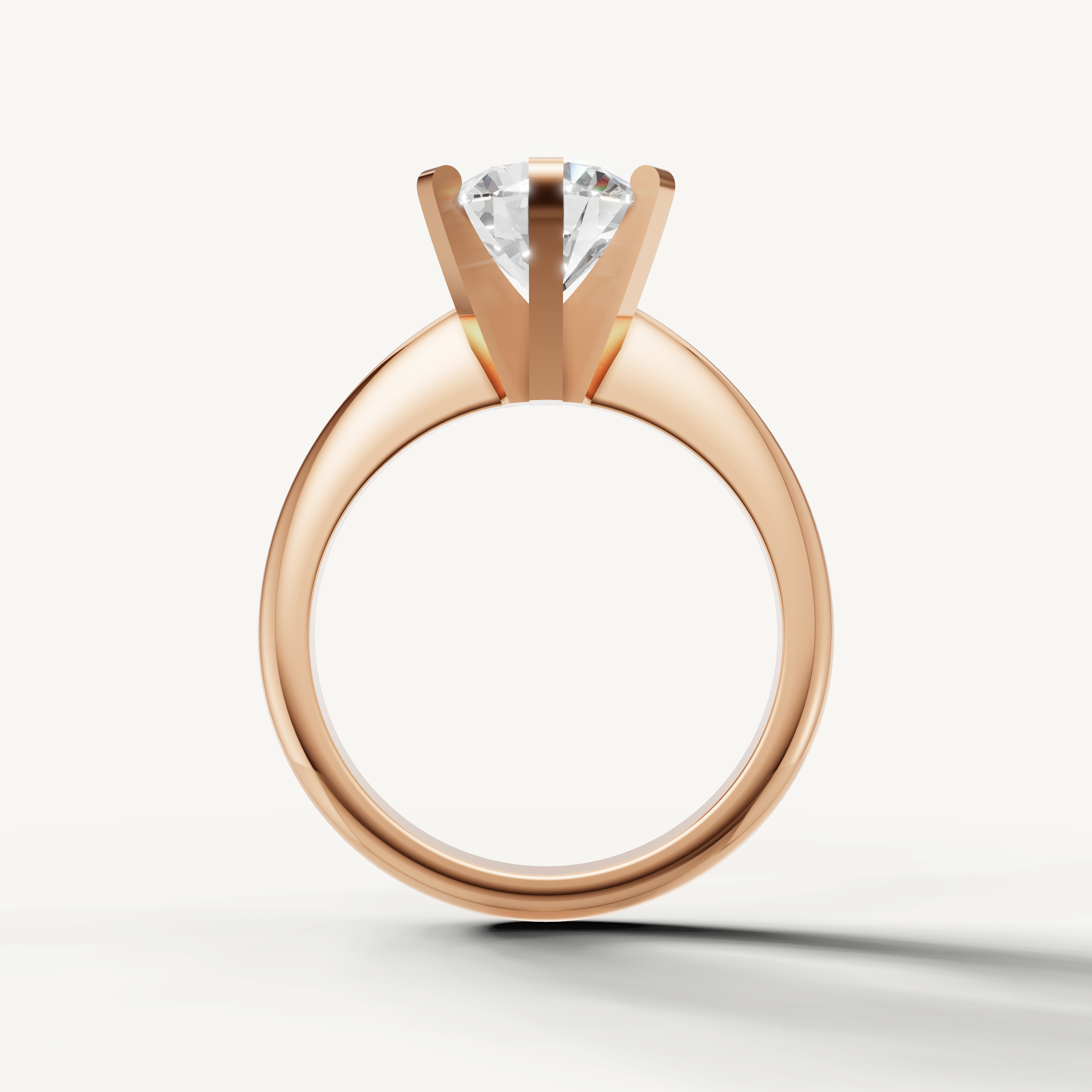Handcrafted rose gold round solitaire ring from Raul Diamonds collection.