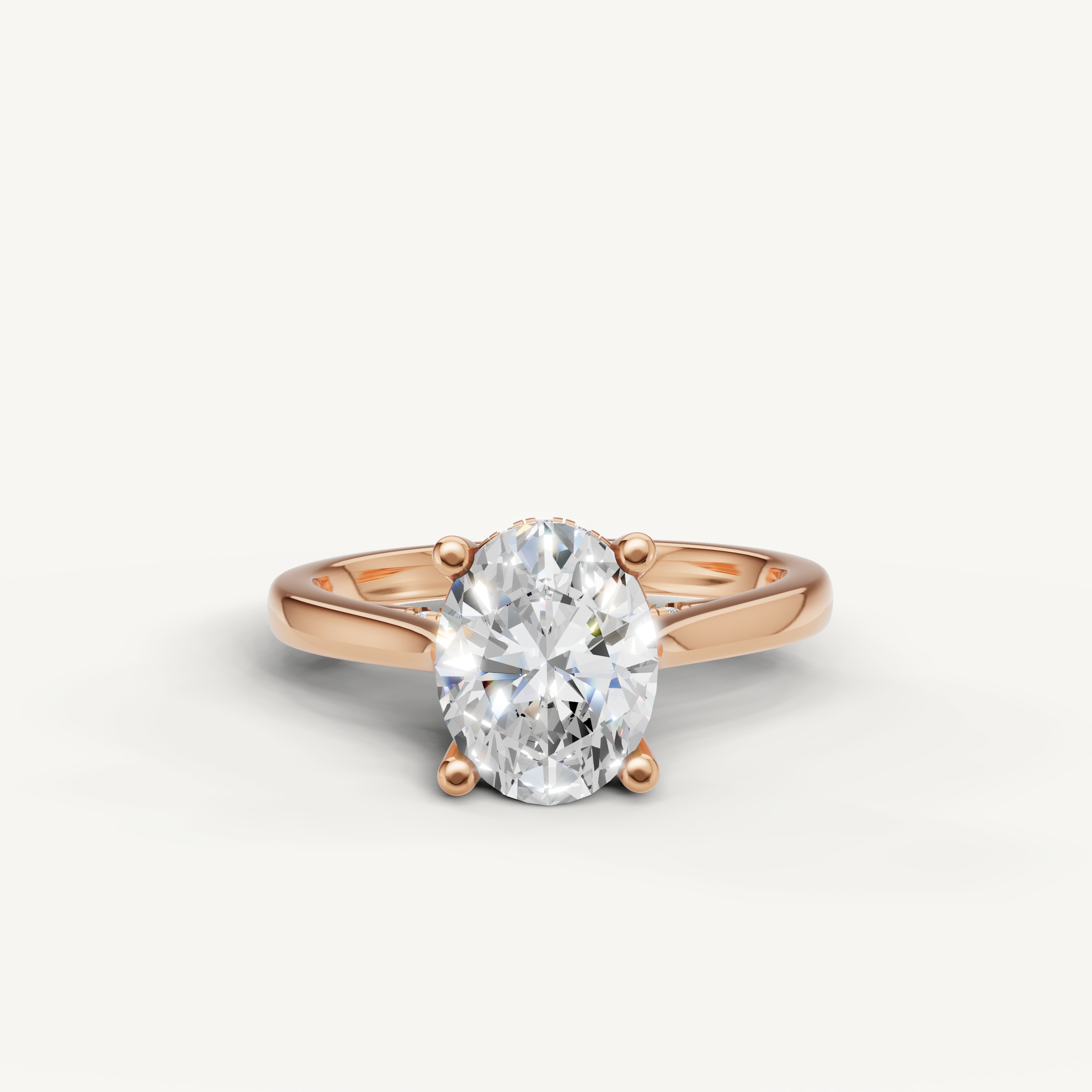 Raul Diamonds handcrafted rose gold oval ring with a shimmering hidden halo under the center stone.