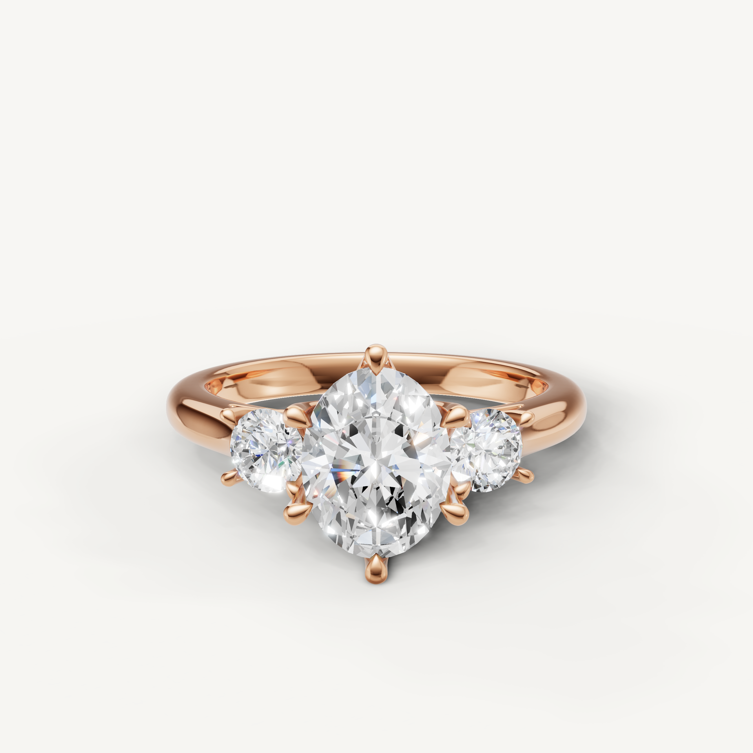 Oval cut three stone lab grown diamond engagement ring in 14K rose gold