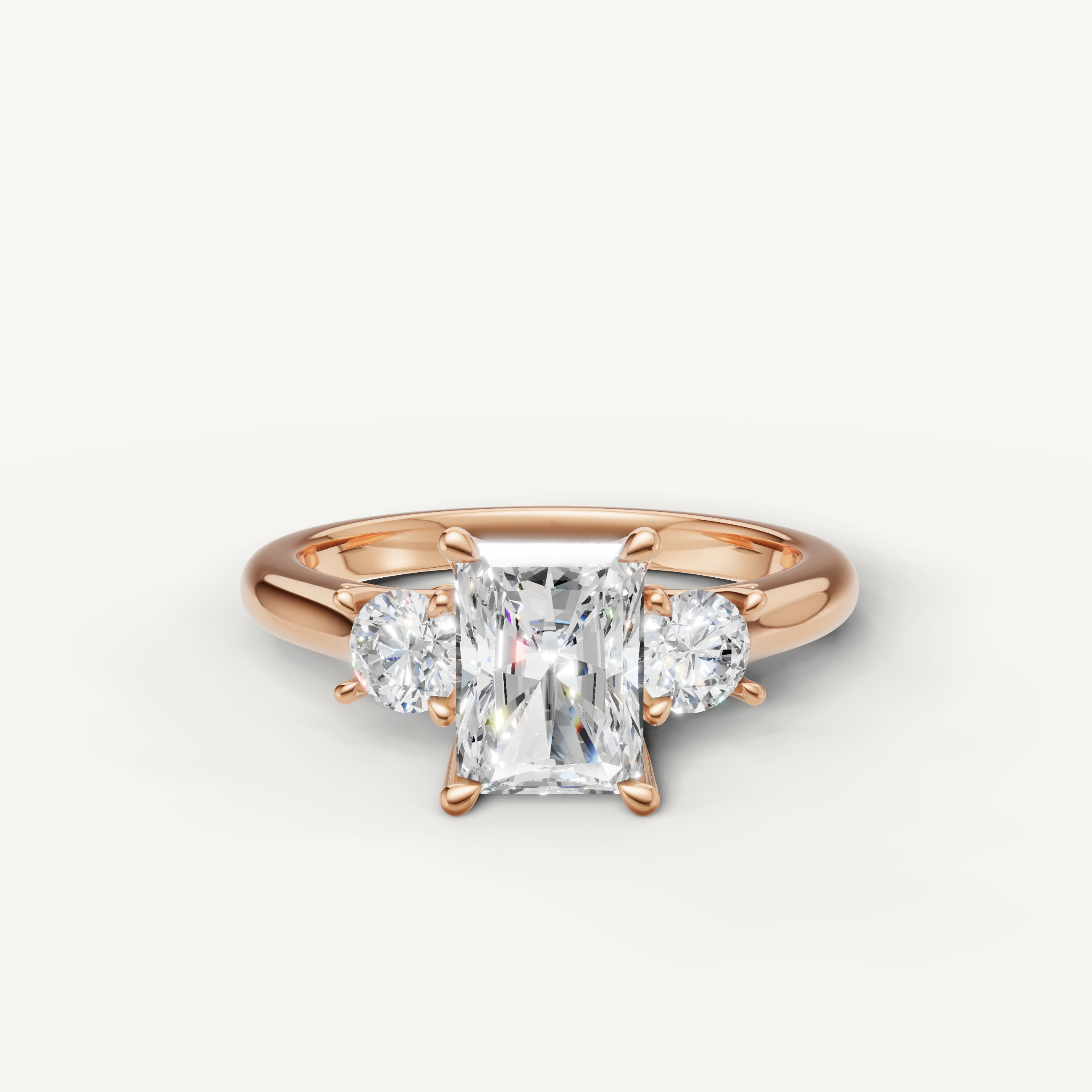 Radiant cut three stone lab grown diamond engagement ring in 14K rose gold
