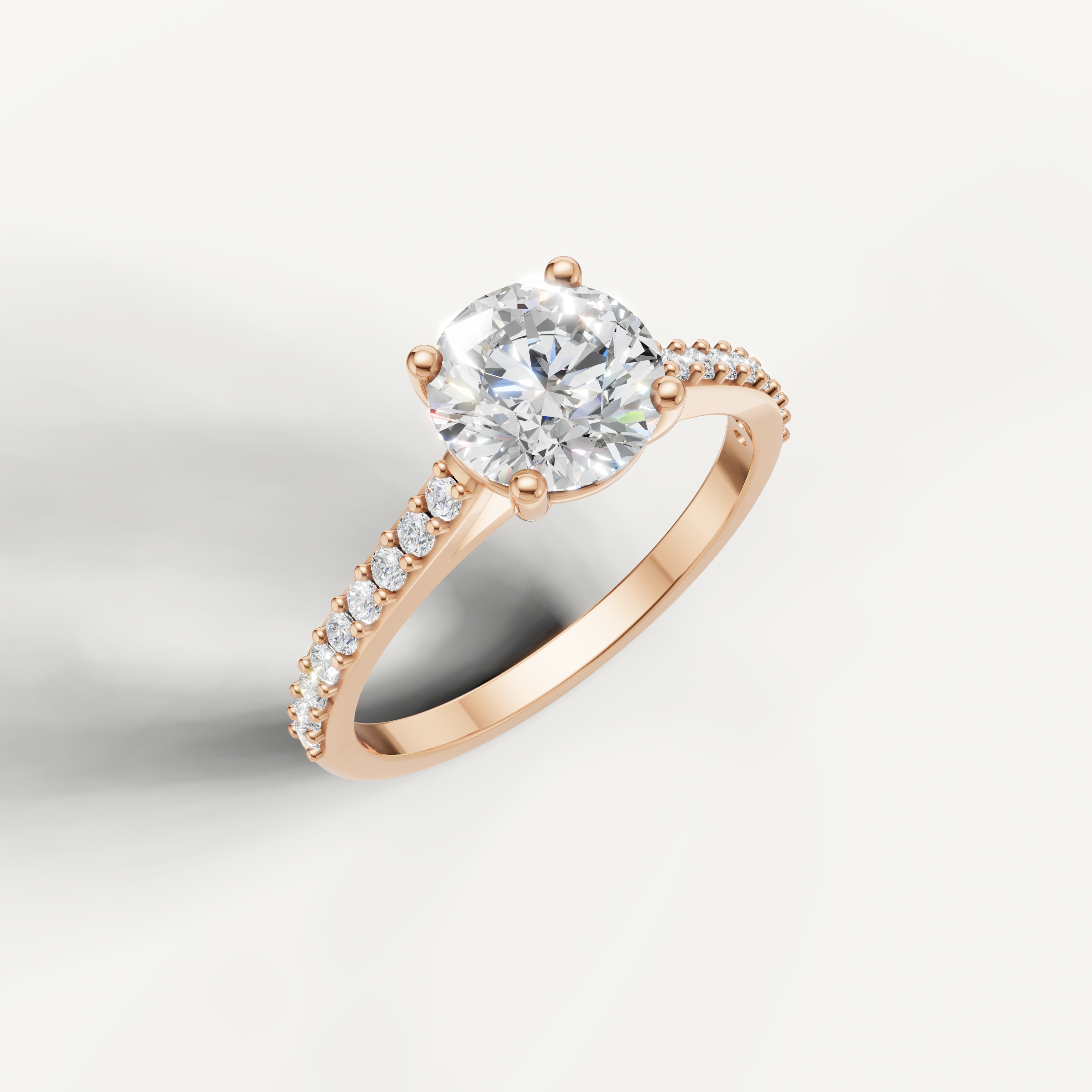 Rose gold round cut engagement ring with brilliant center diamond by Raul Diamonds.