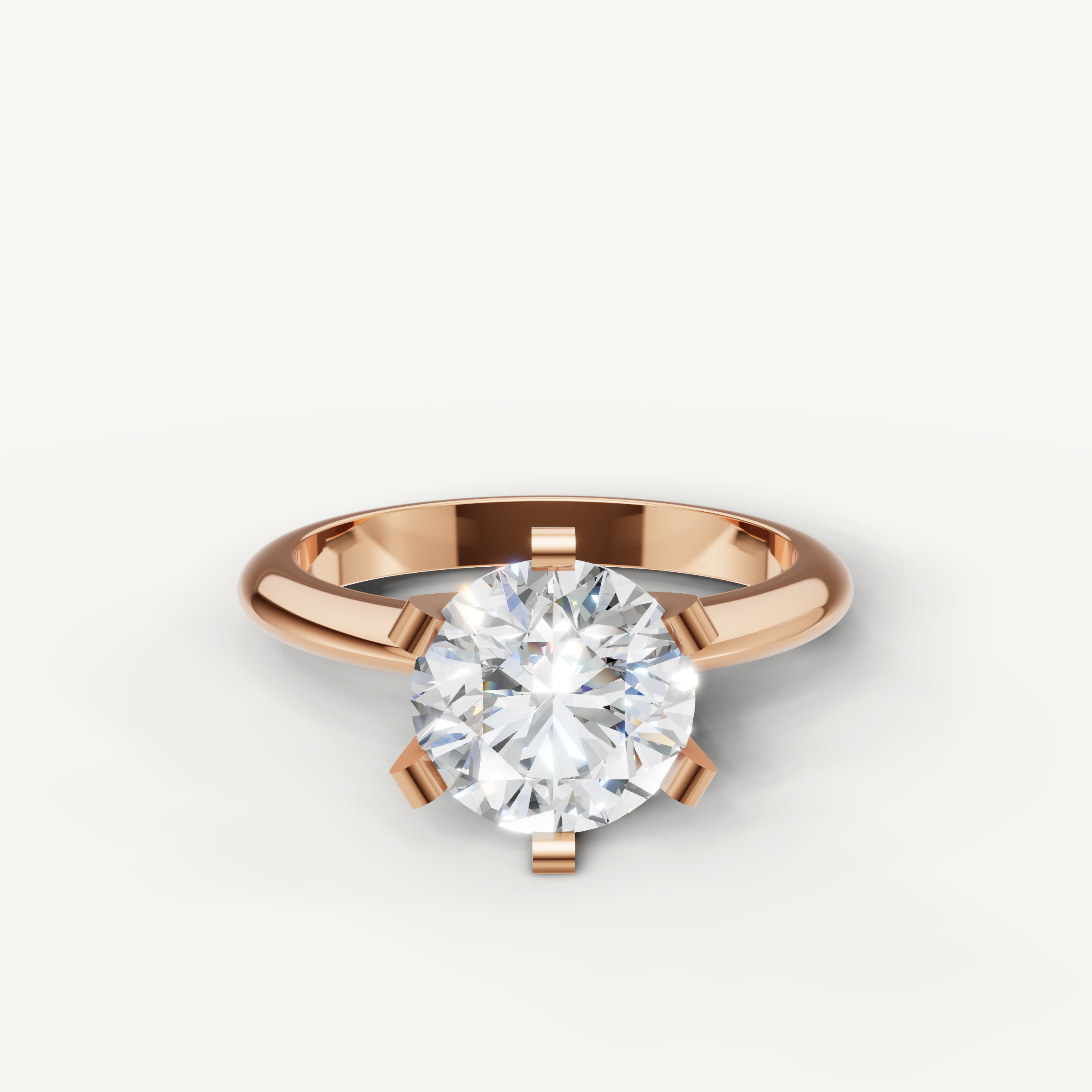 Raul Diamonds rose gold round solitaire diamond engagement ring with modern design.