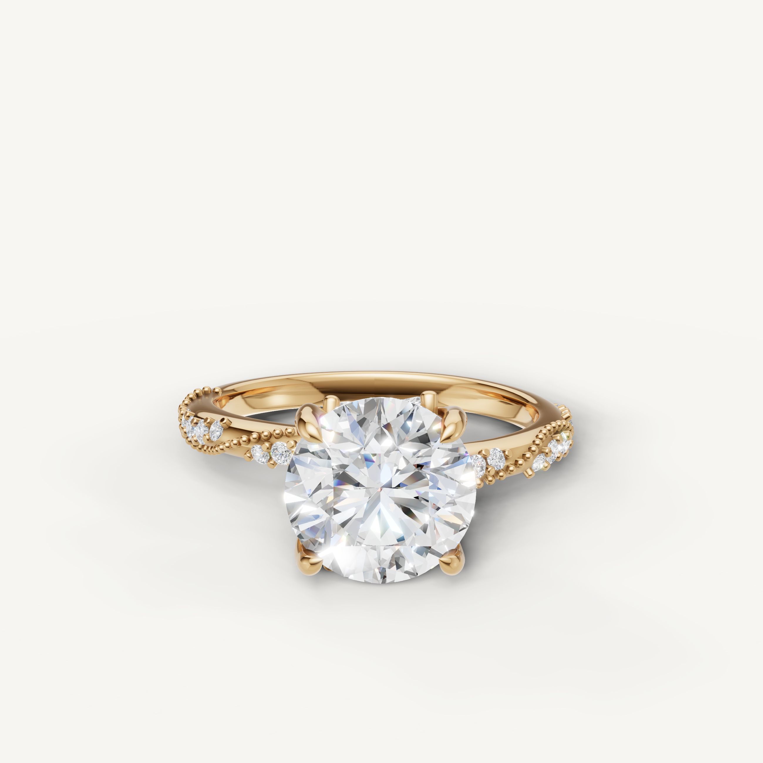round brilliant lab grown diamond engagement ring with twisted pavé band yellow gold