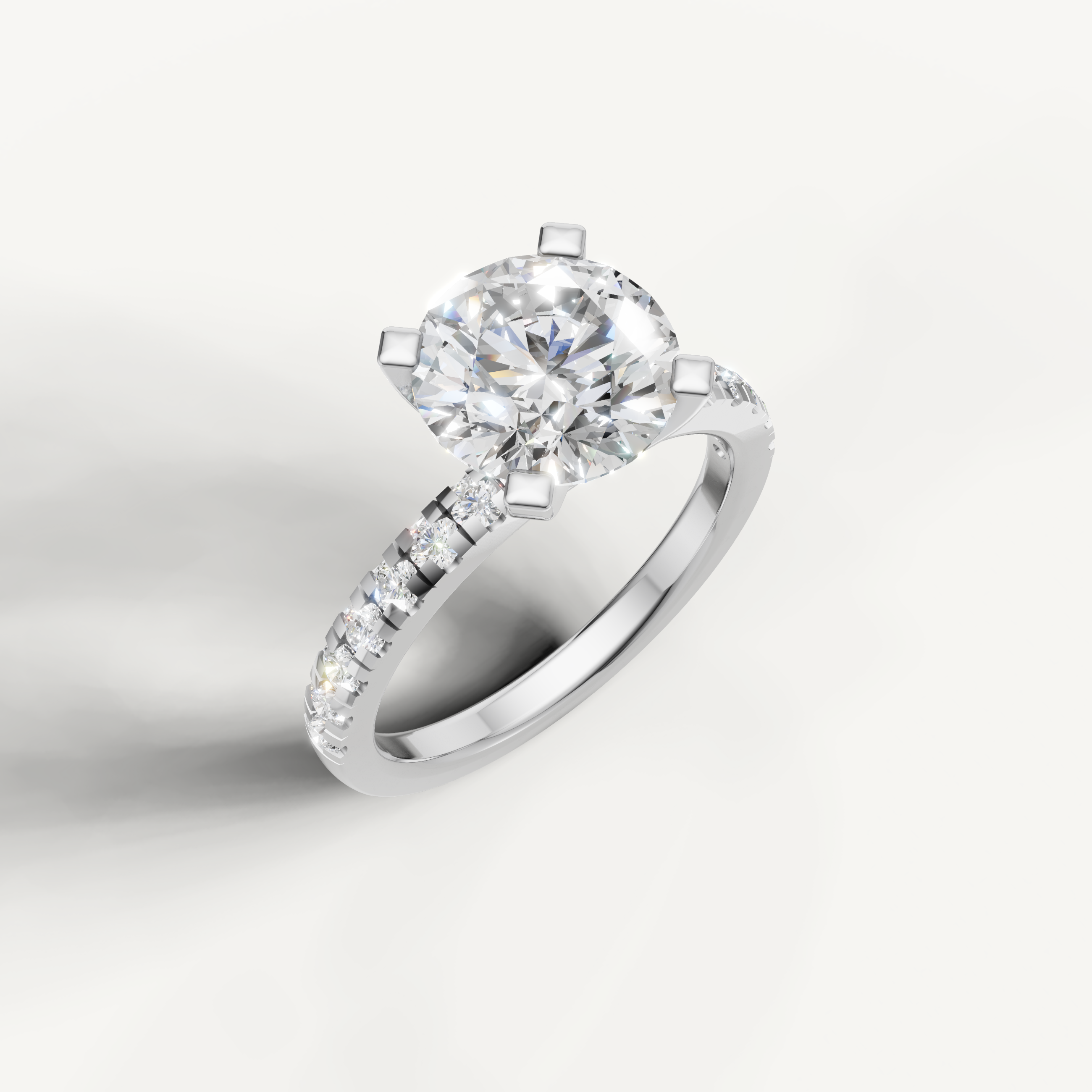 Timeless white gold round brilliant diamond ring with elegant band setting.