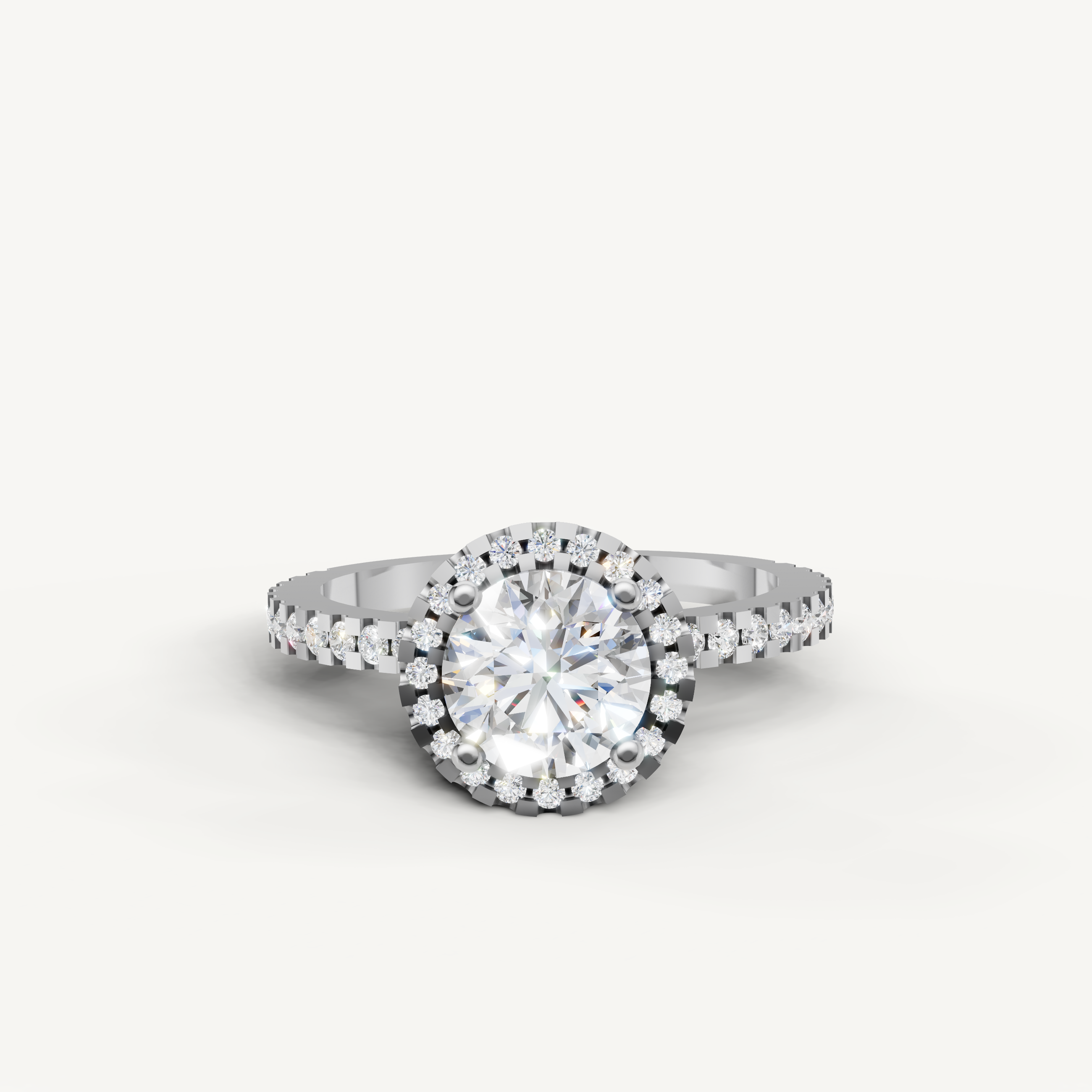 White gold round halo engagement ring with pavé diamonds by Raul Diamonds.