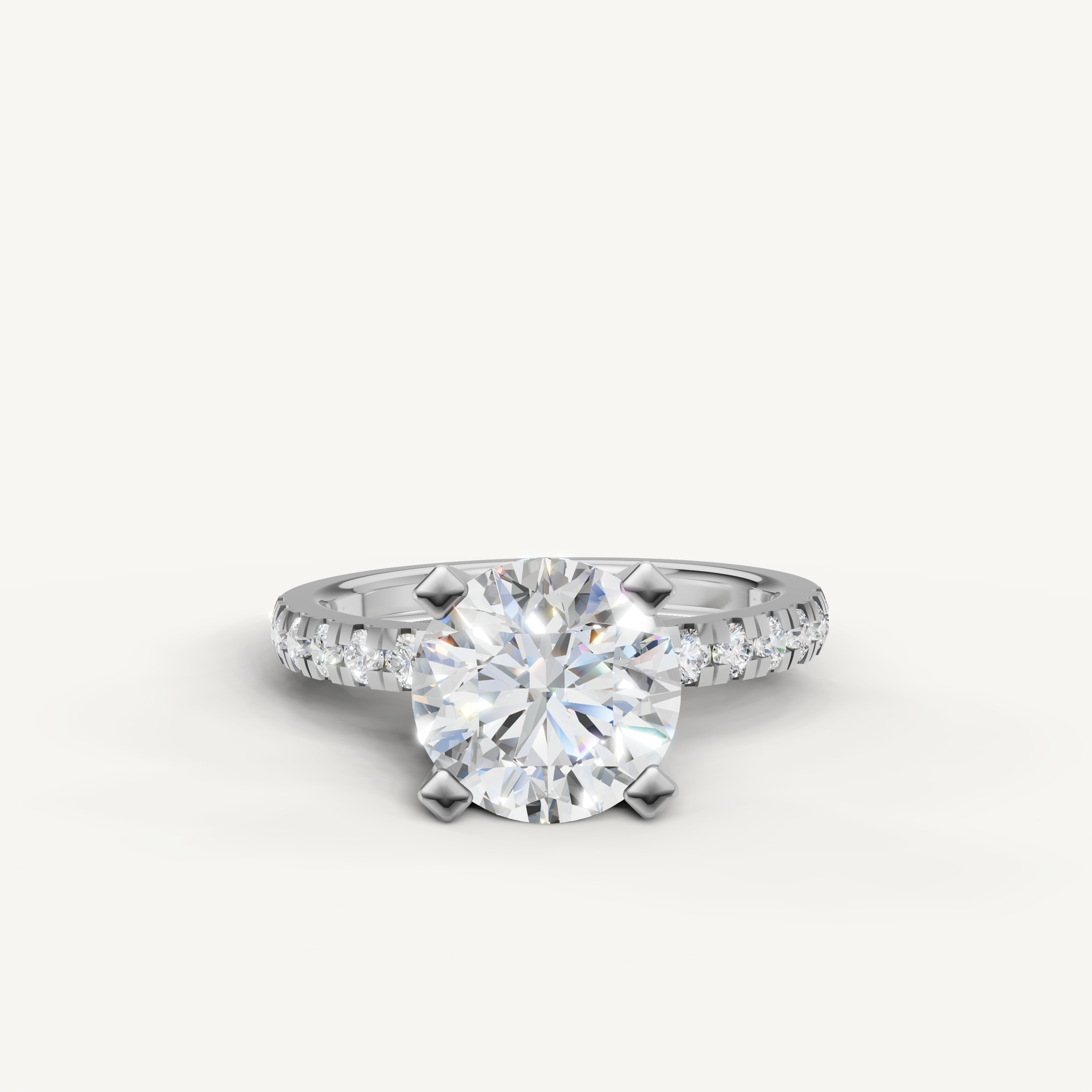 White gold round solitaire engagement ring with pavé diamonds by Raul Diamonds.