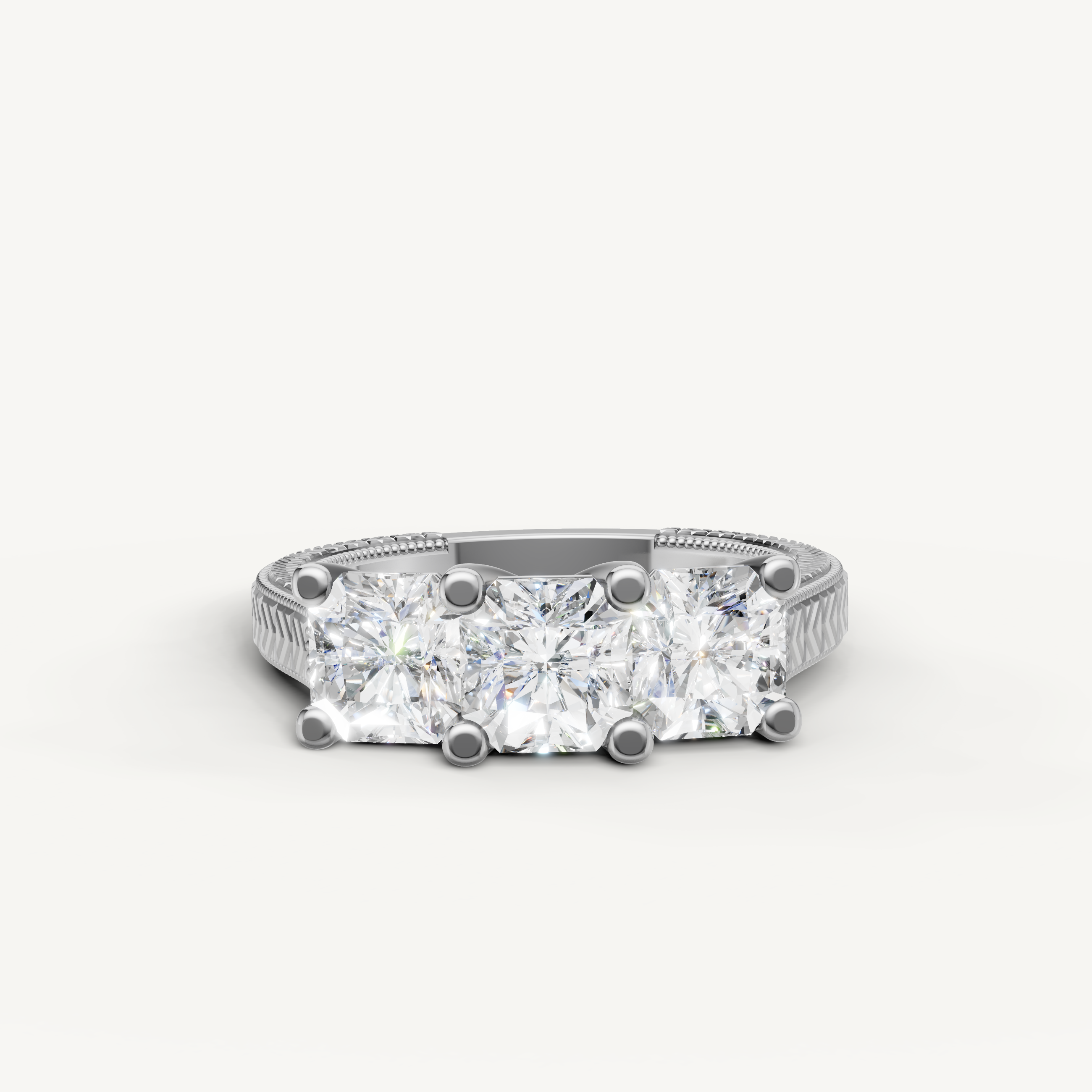 White gold three stone round diamond engagement ring by Raul Diamonds.