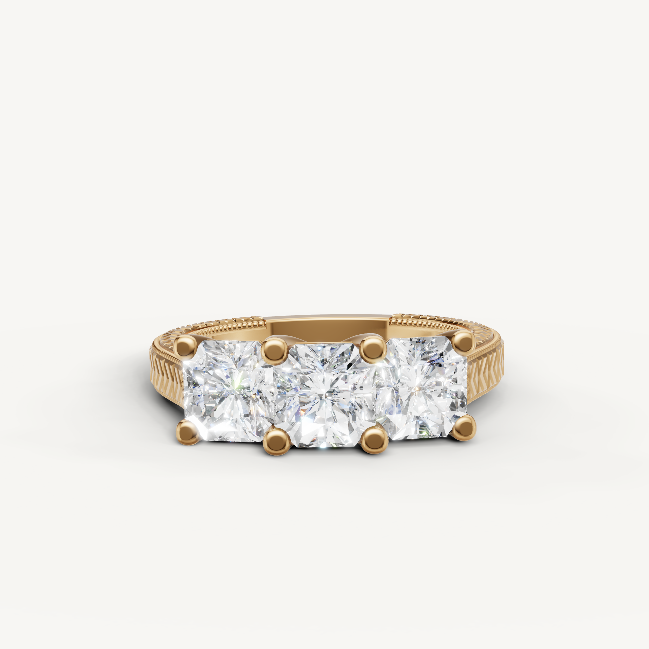 Raul Diamonds three stone round diamond engagement ring in yellow gold.