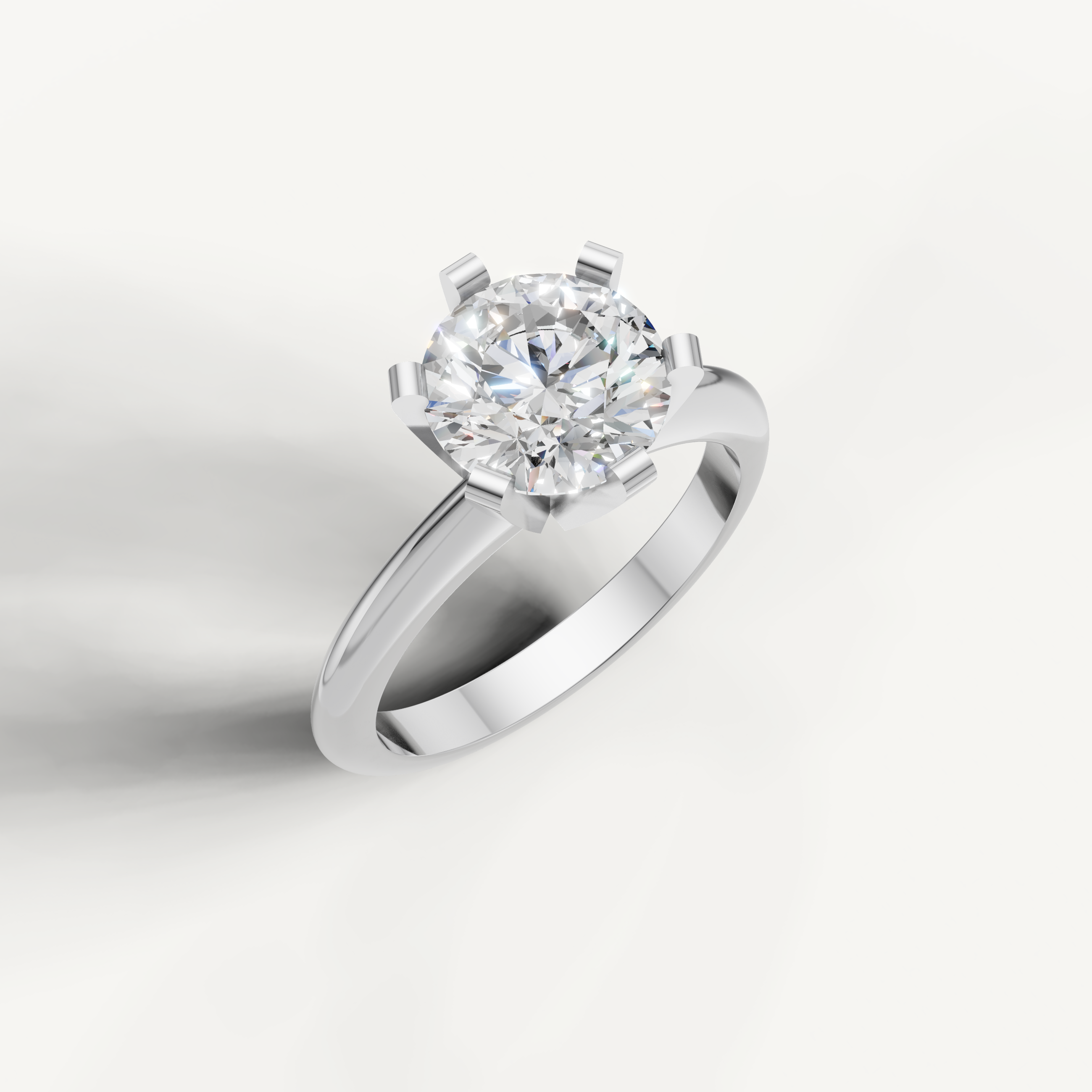 Modern white gold round cut engagement ring with classic prong setting.