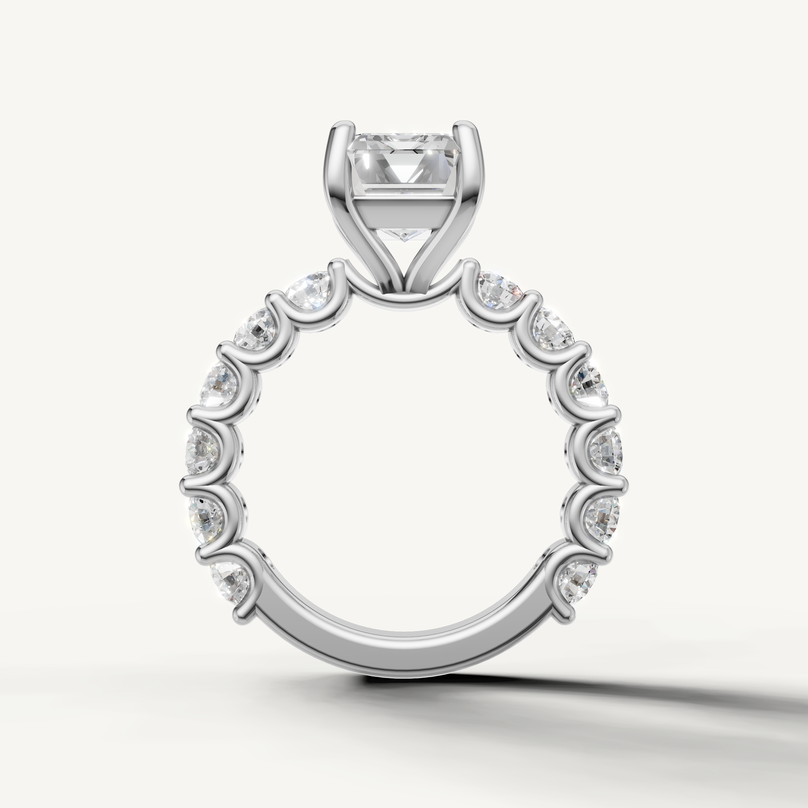 Classic emerald engagement ring with open gallery shared prong band white gold