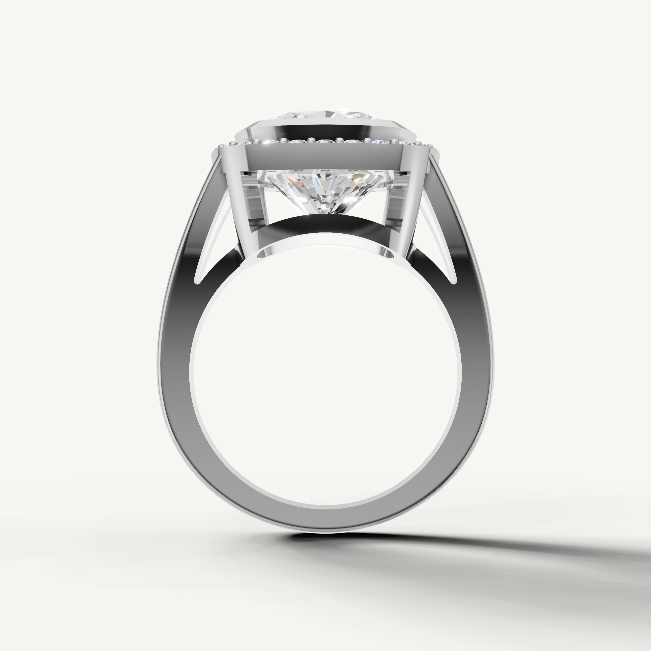 Premium pear diamond halo ring in white gold with elegant pavé accents by Raul Diamonds.