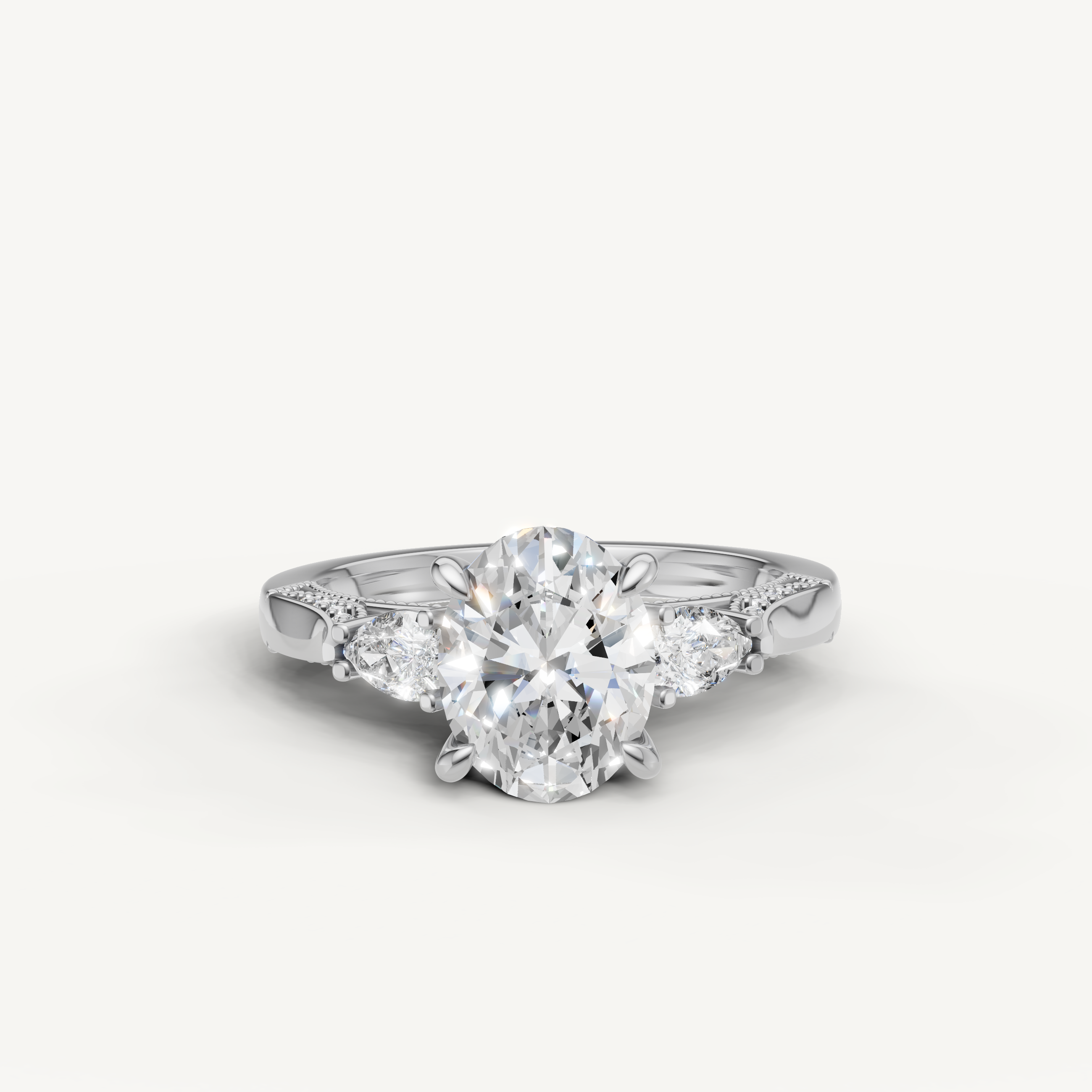 Oval cut lab grown diamond three stone ring with pear side stones white gold engagement ring