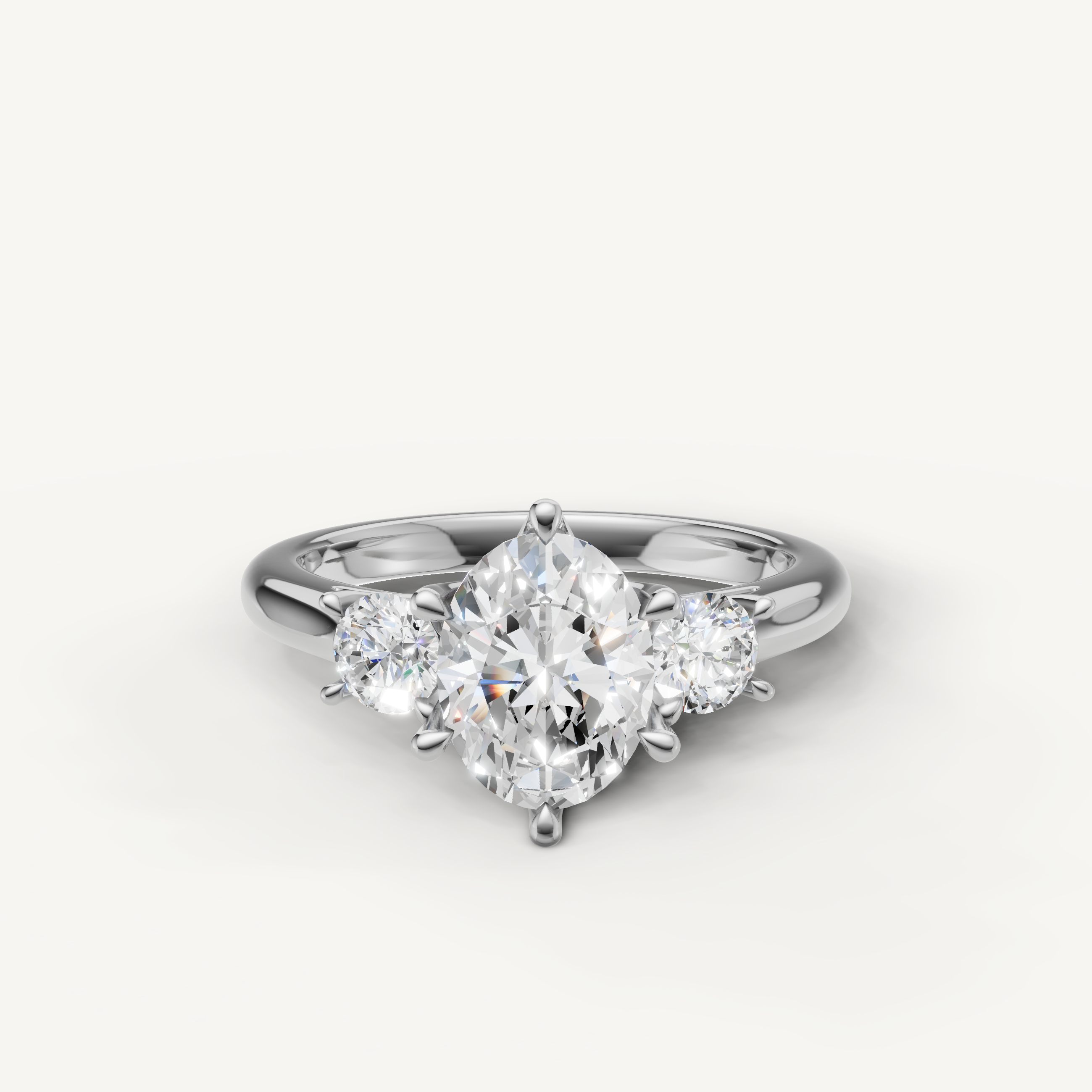 Oval cut three stone lab grown diamond engagement ring in 14K white gold