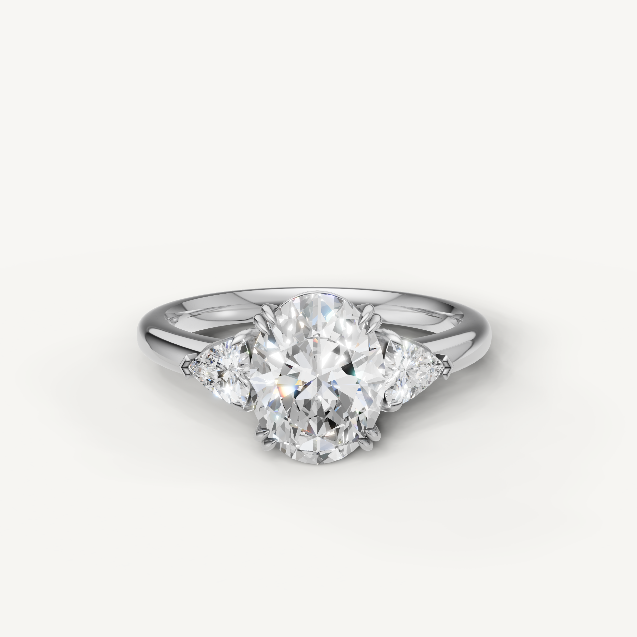 oval cut lab grown diamond engagement ring with trillion side stones in 14k white gold
