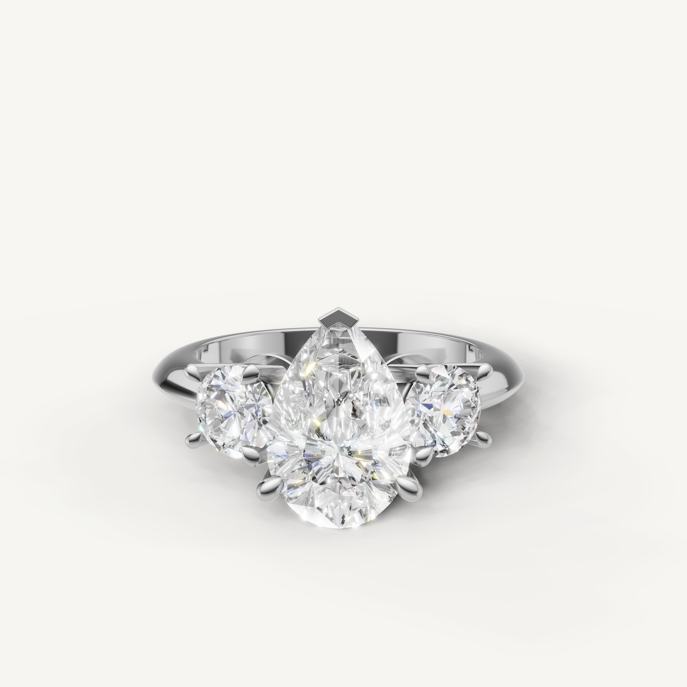Pear cut three stone lab grown diamond engagement ring in 14K white gold