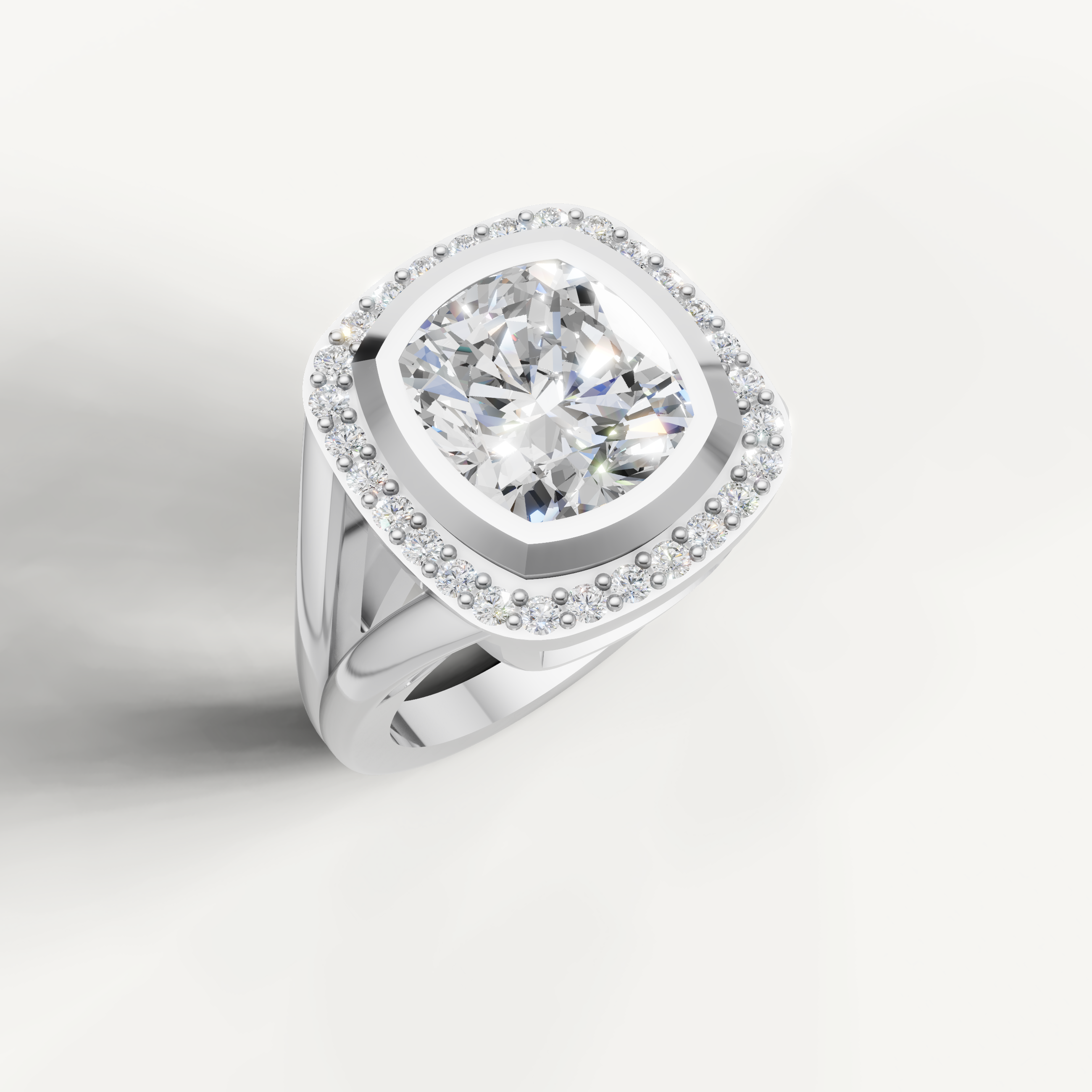 Modern white gold pear shaped diamond ring with cushion halo setting.