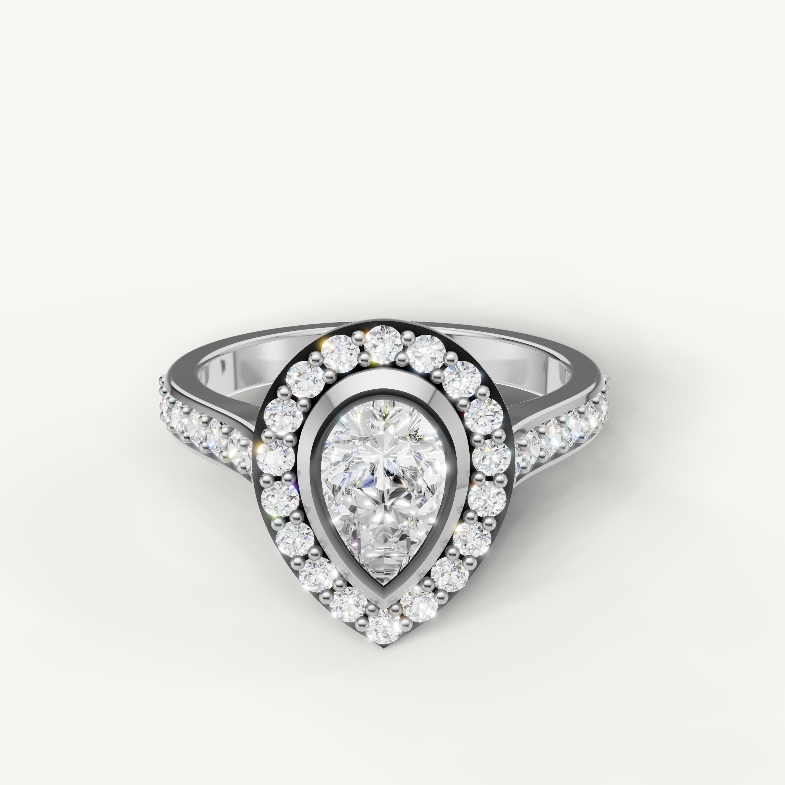 Raul Diamonds white gold pear shaped engagement ring with brilliant halo diamonds