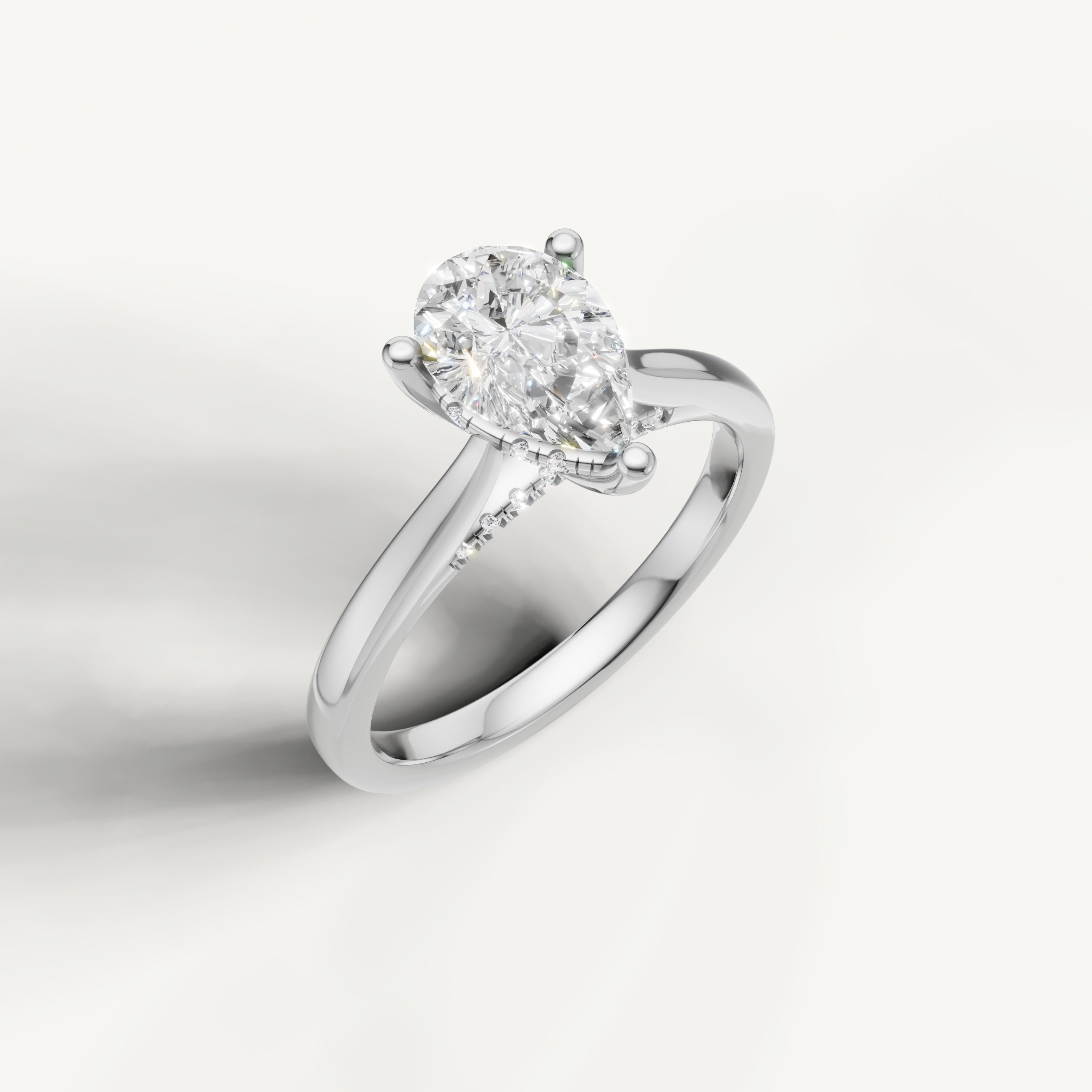White gold pear-cut lab-grown diamond solitaire ring with pavé hidden halo setting