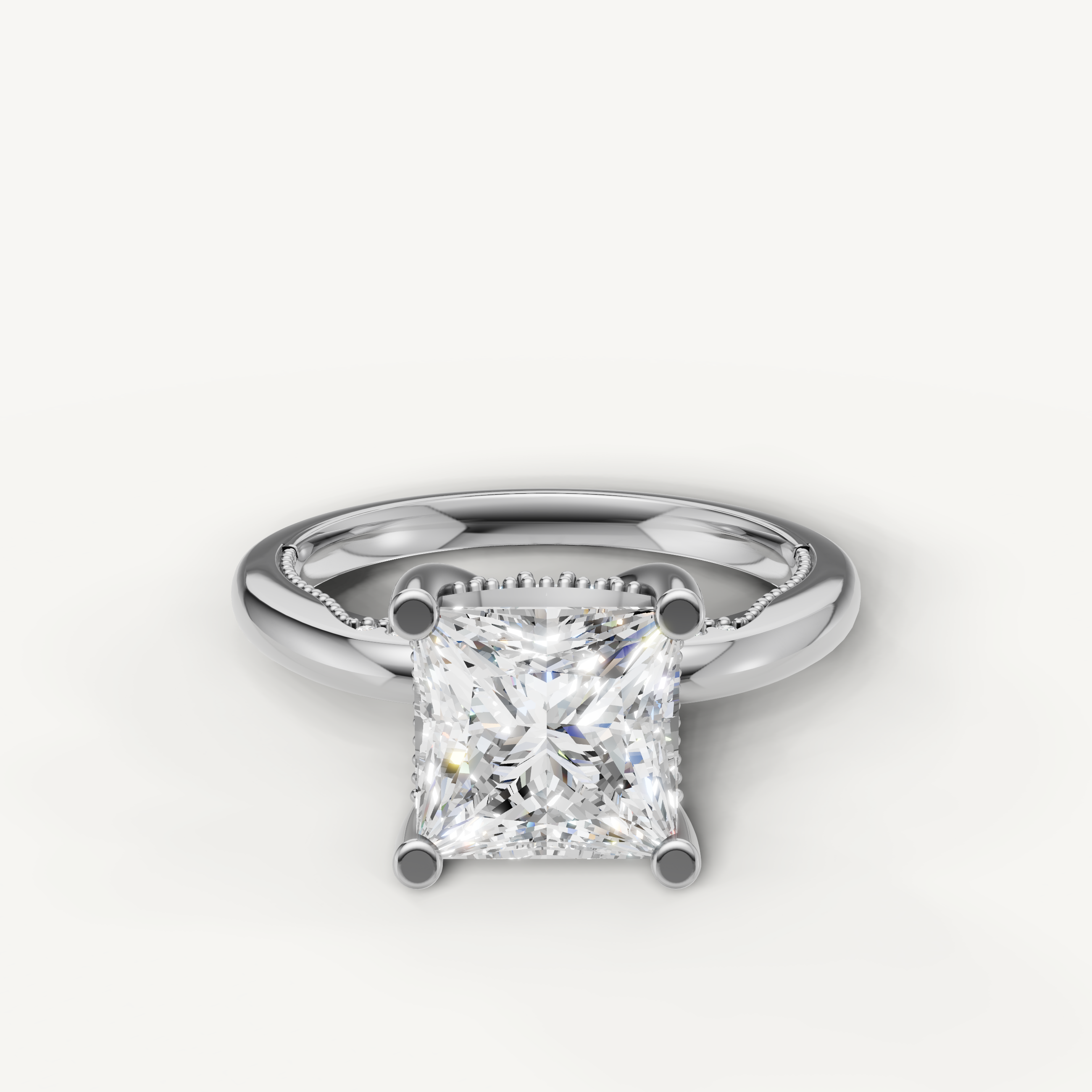 A classic solitaire engagement ring in bright, polished white gold or platinum, featuring a dazzling, high-clarity princess-cut diamond.
