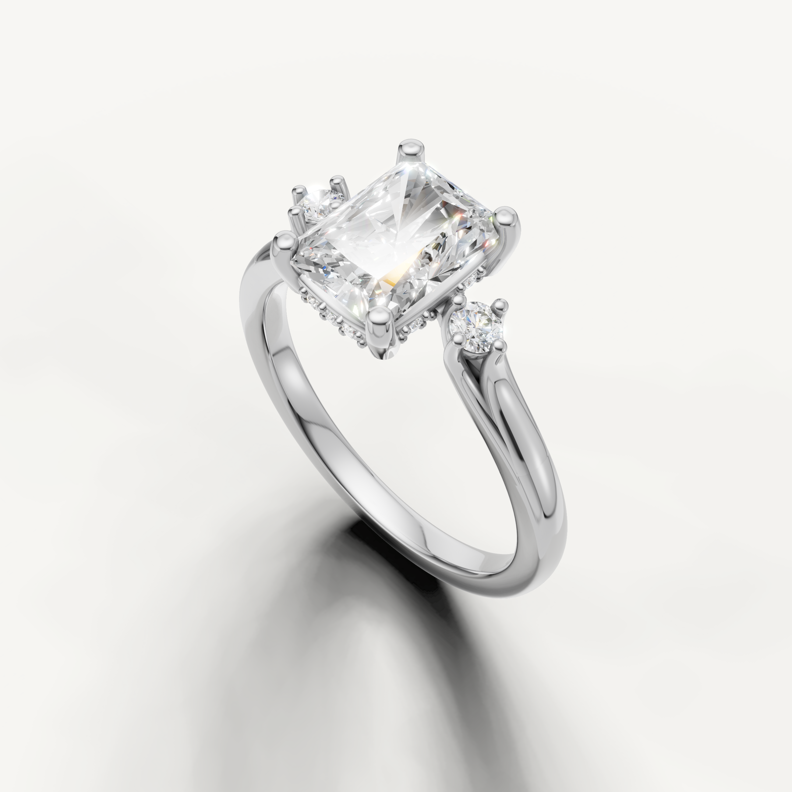 Raul Diamonds white gold radiant engagement ring with luxurious three stone silhouette
