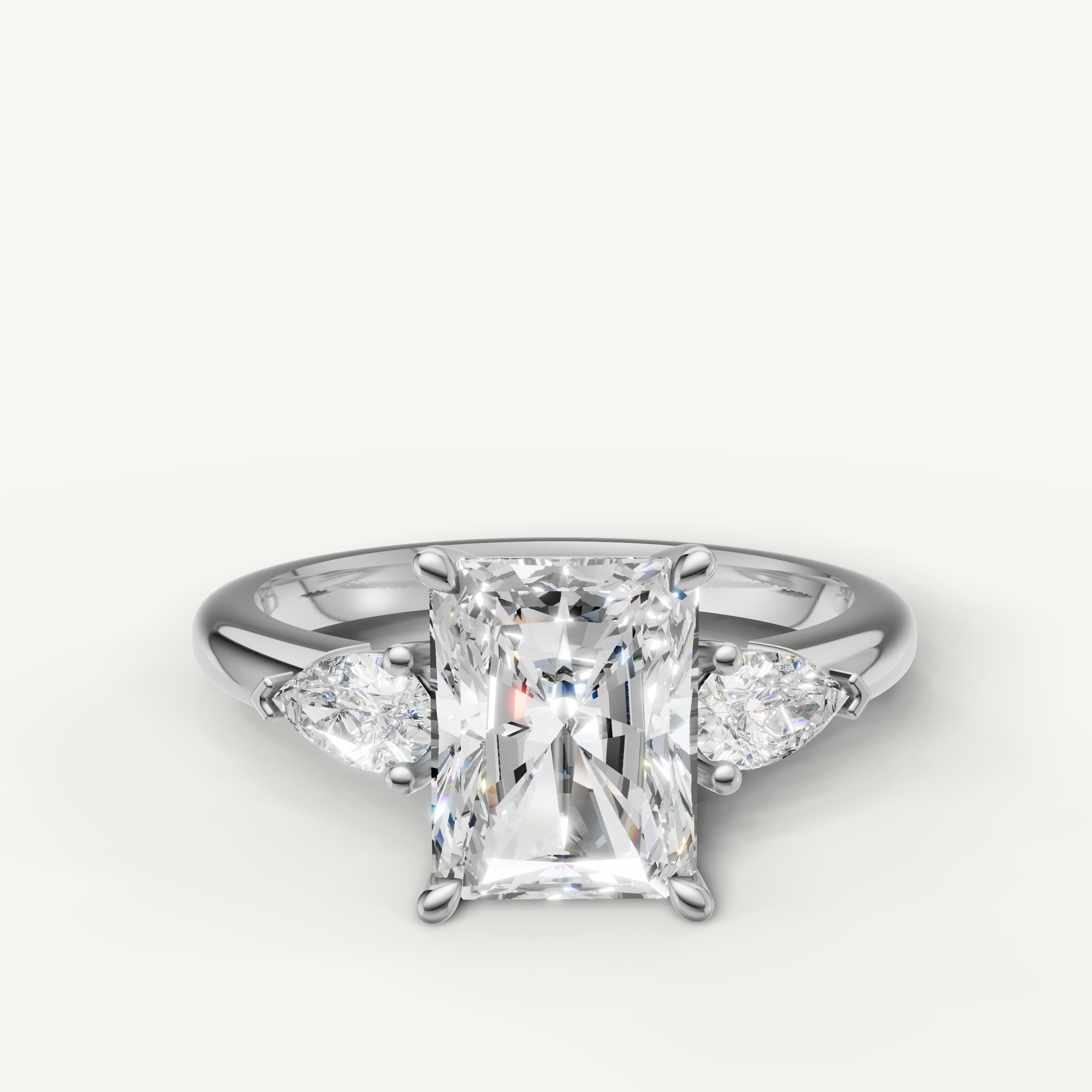 radiant cut lab grown diamond engagement ring with pear side stones in 14k white gold