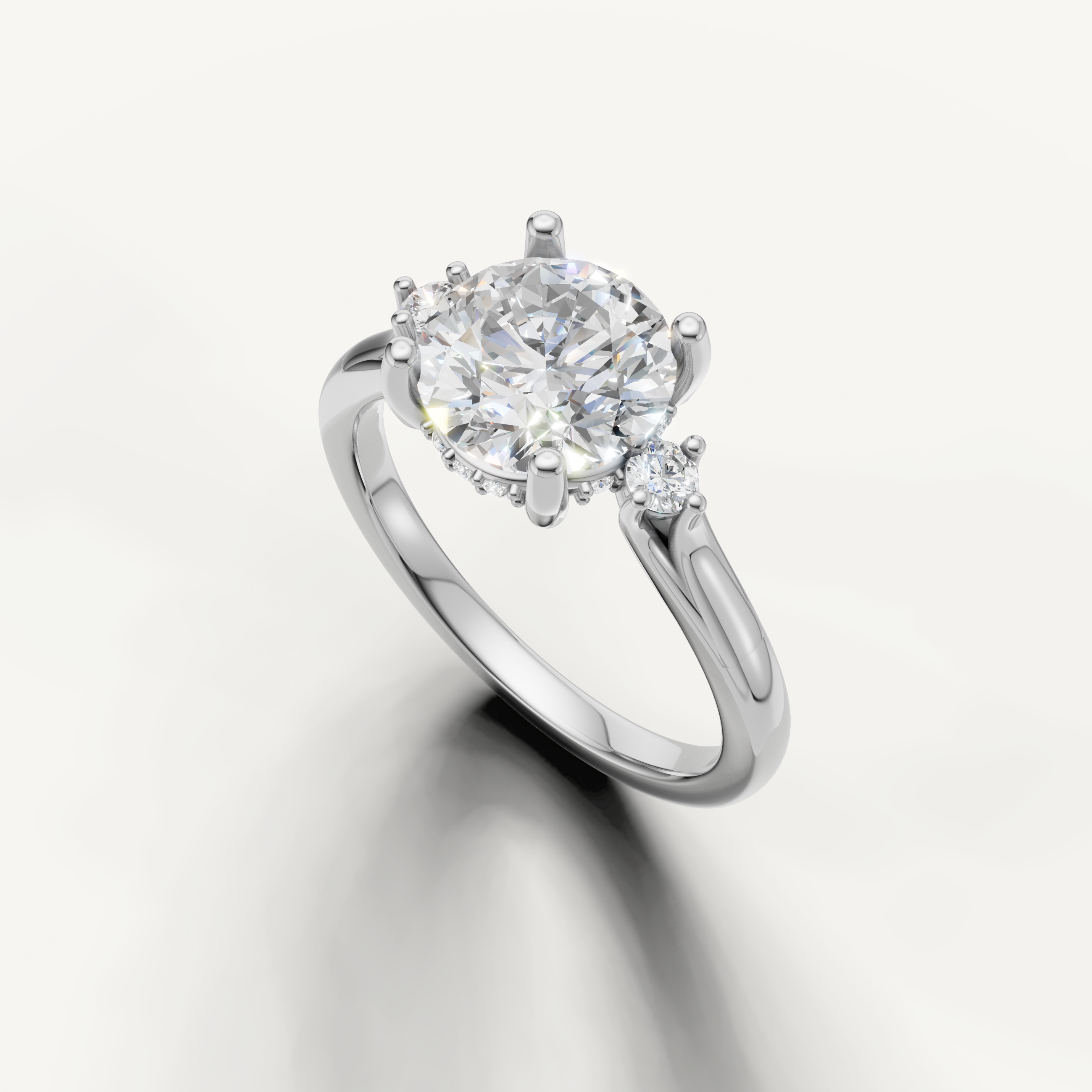 Raul Diamonds white gold round engagement ring with luxurious three stone setting