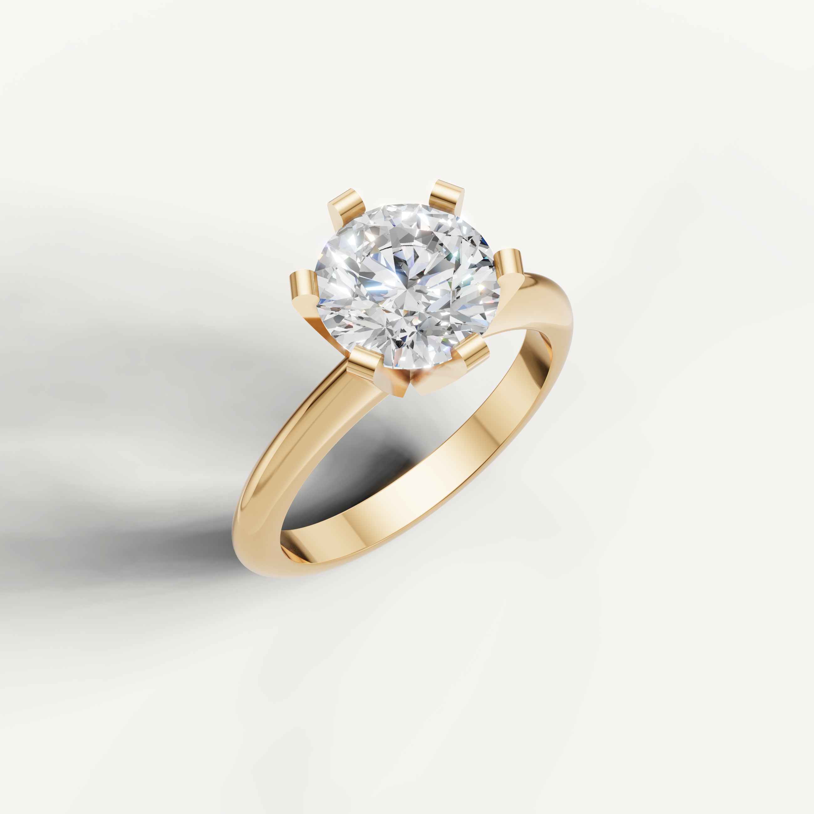 Elegant round cut diamond ring in yellow gold from Raul Diamonds.