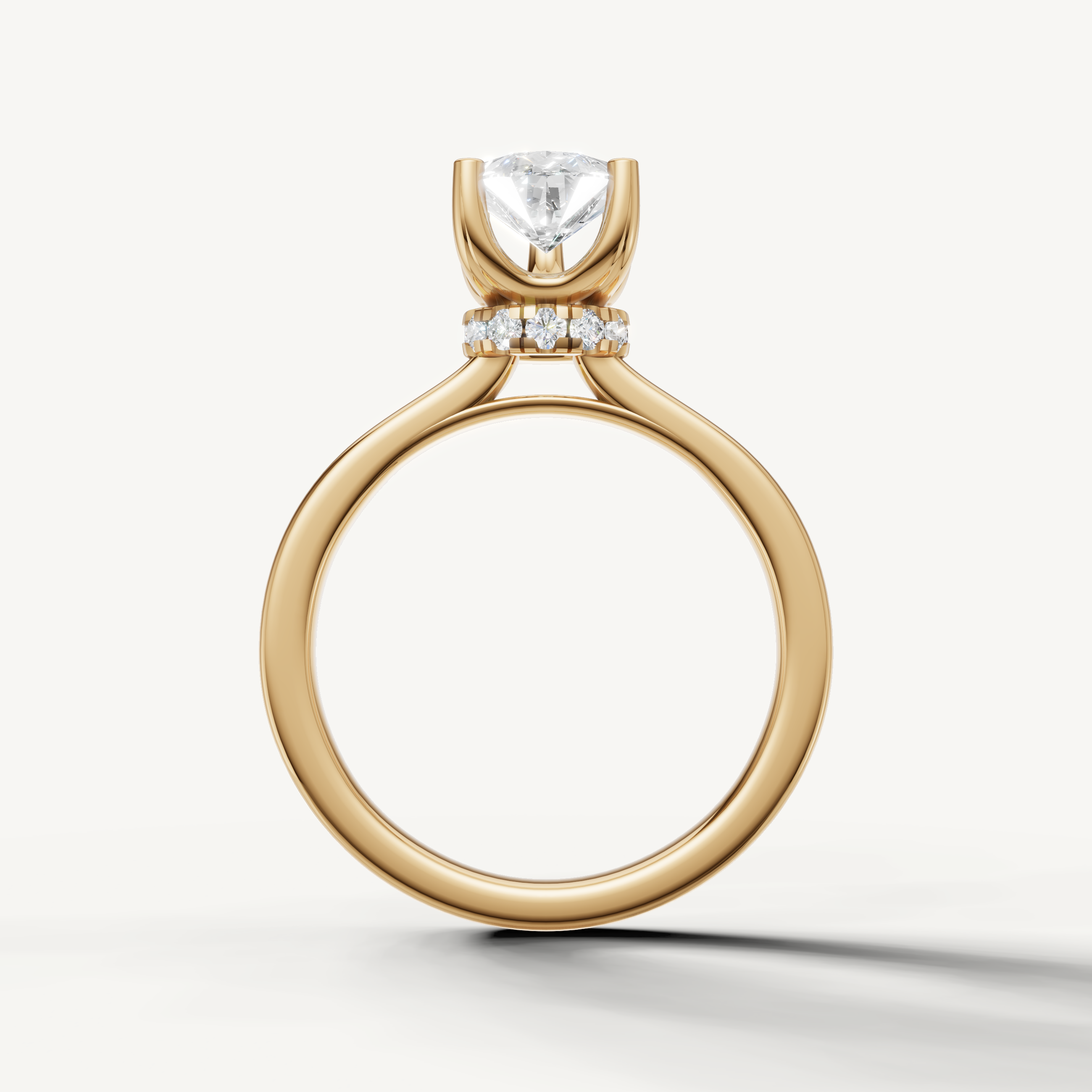 minimalist pear shaped lab grown diamond engagement ring with sleek yellow gold setting