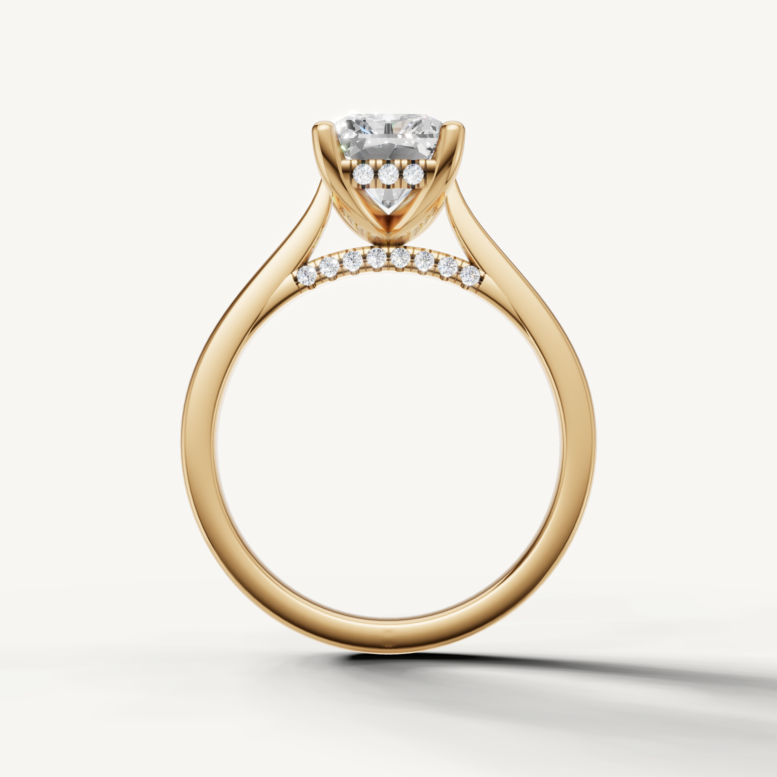 Elegant yellow gold radiant-shaped lab-grown diamond ring with hidden pavé halo