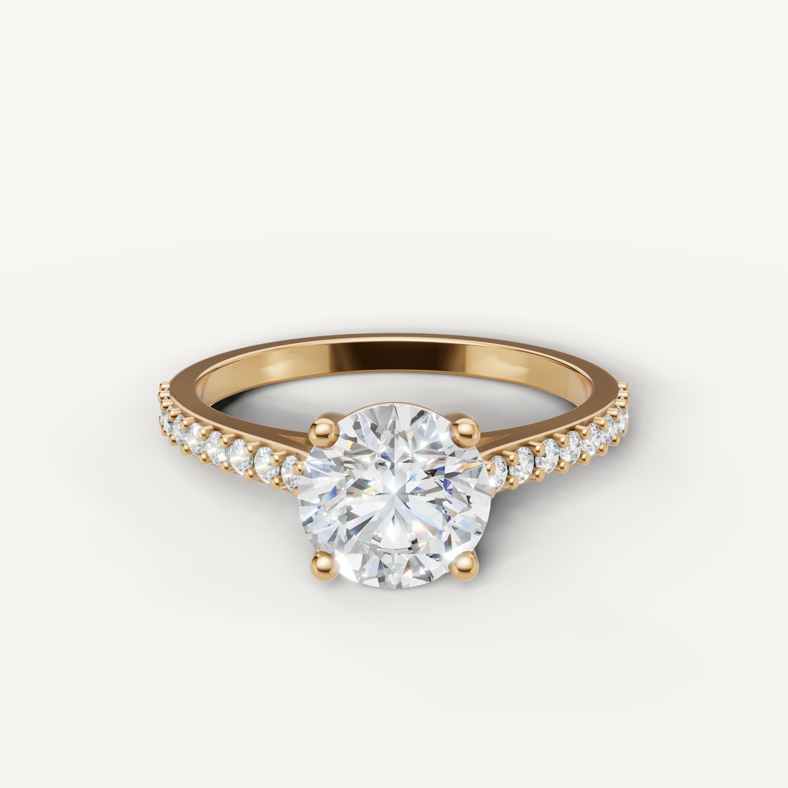 Raul Diamonds yellow gold round solitaire diamond engagement ring with pavé band.