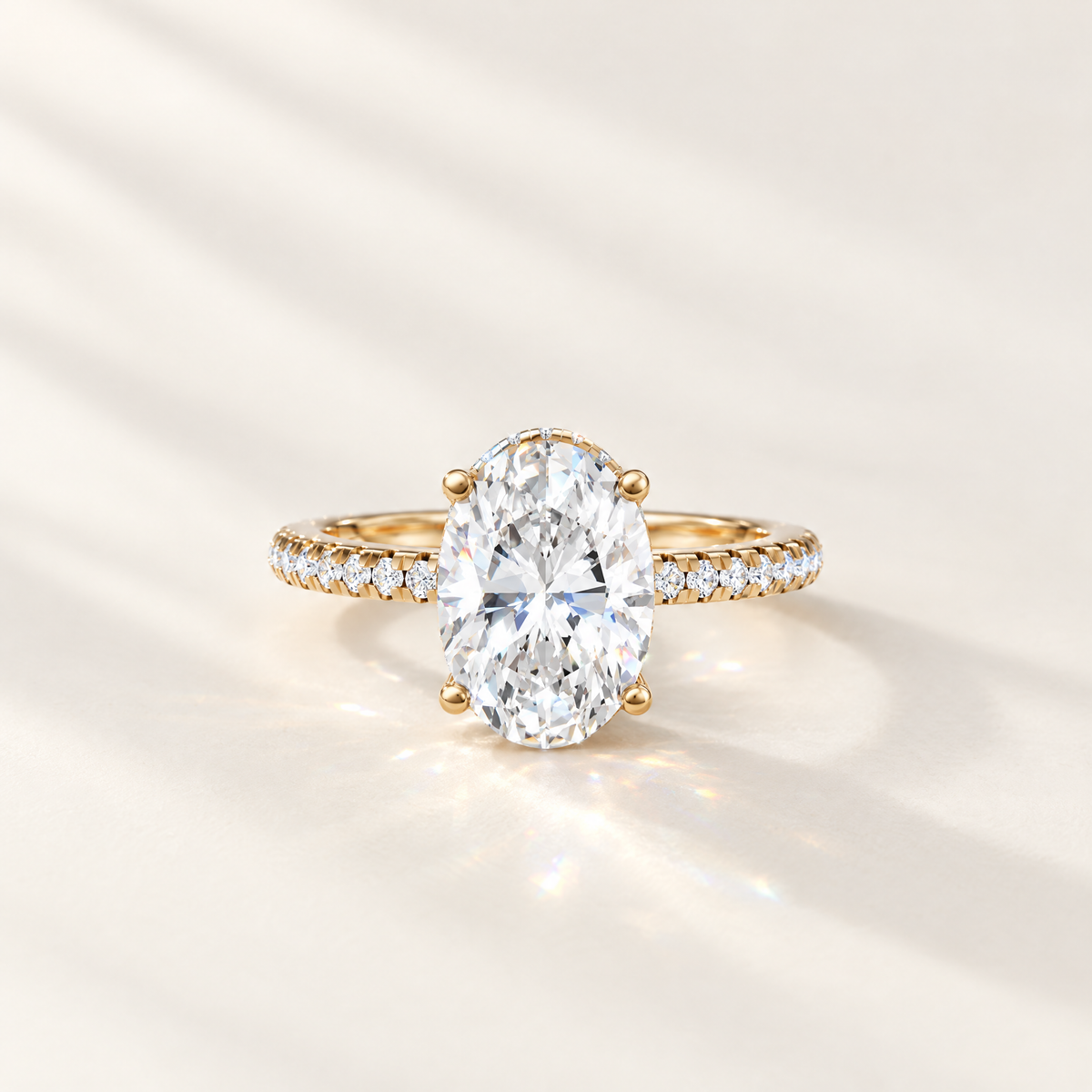 Finished oval lab grown diamond engagement ring in yellow gold