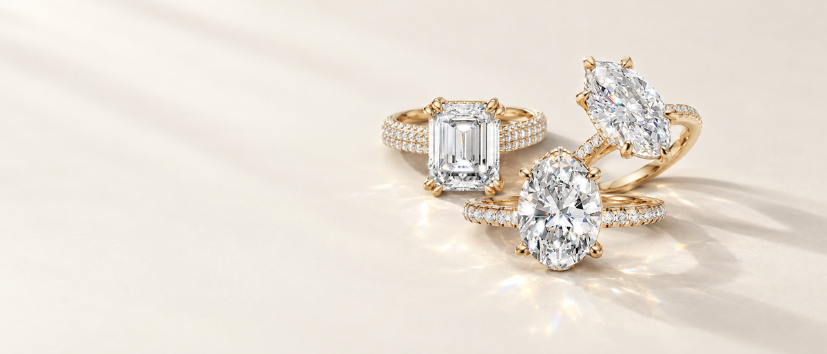 Emerald, oval and marquise lab-grown diamond engagement rings in 14K yellow gold by Raul Diamonds