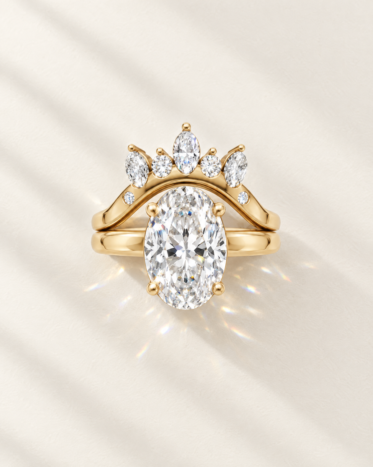Oval lab-grown diamond bridal set with marquise crown wedding band in 14K yellow gold