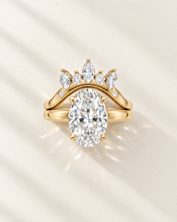 Oval lab-grown diamond bridal set with marquise crown wedding band in 14K yellow gold