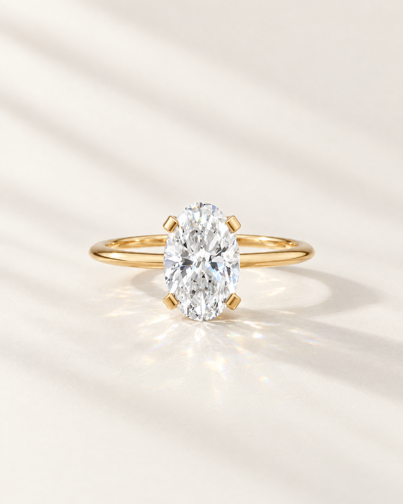 Oval lab-grown diamond solitaire engagement ring in 14K yellow gold