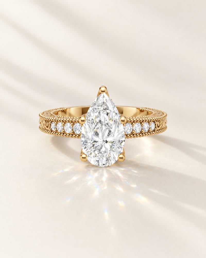 Pear lab-grown diamond vintage style engagement ring with milgrain and filigree band in 14K yellow gold
