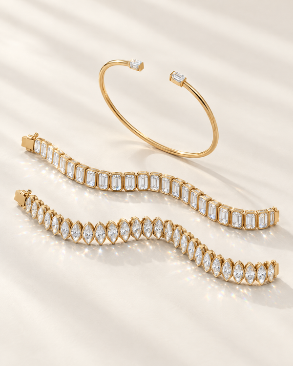Lab-grown diamond tennis bracelets and an open cuff bangle in 14K yellow gold