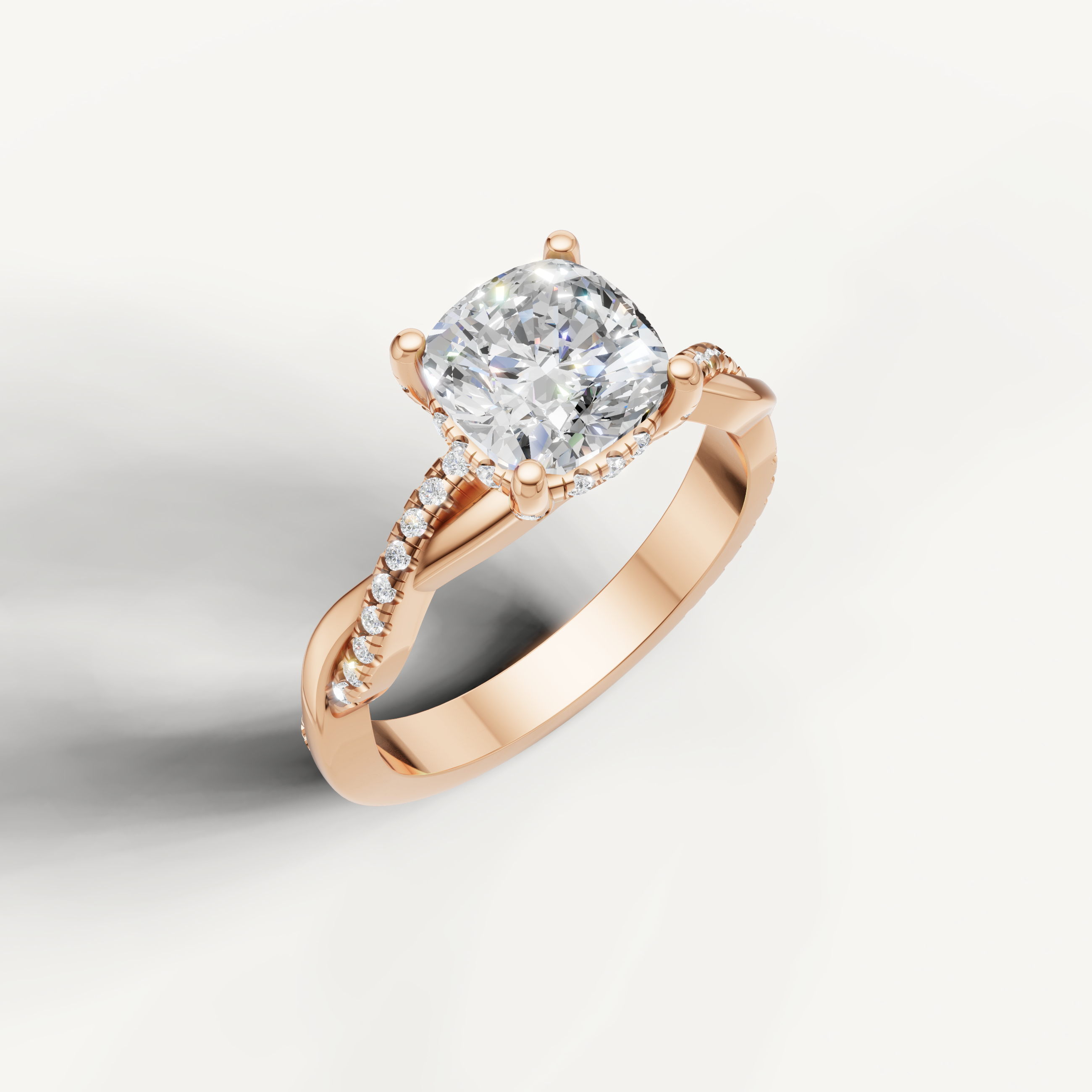romantic cushion cut lab grown diamond engagement ring in 14k rose gold with twisted pavé diamond band